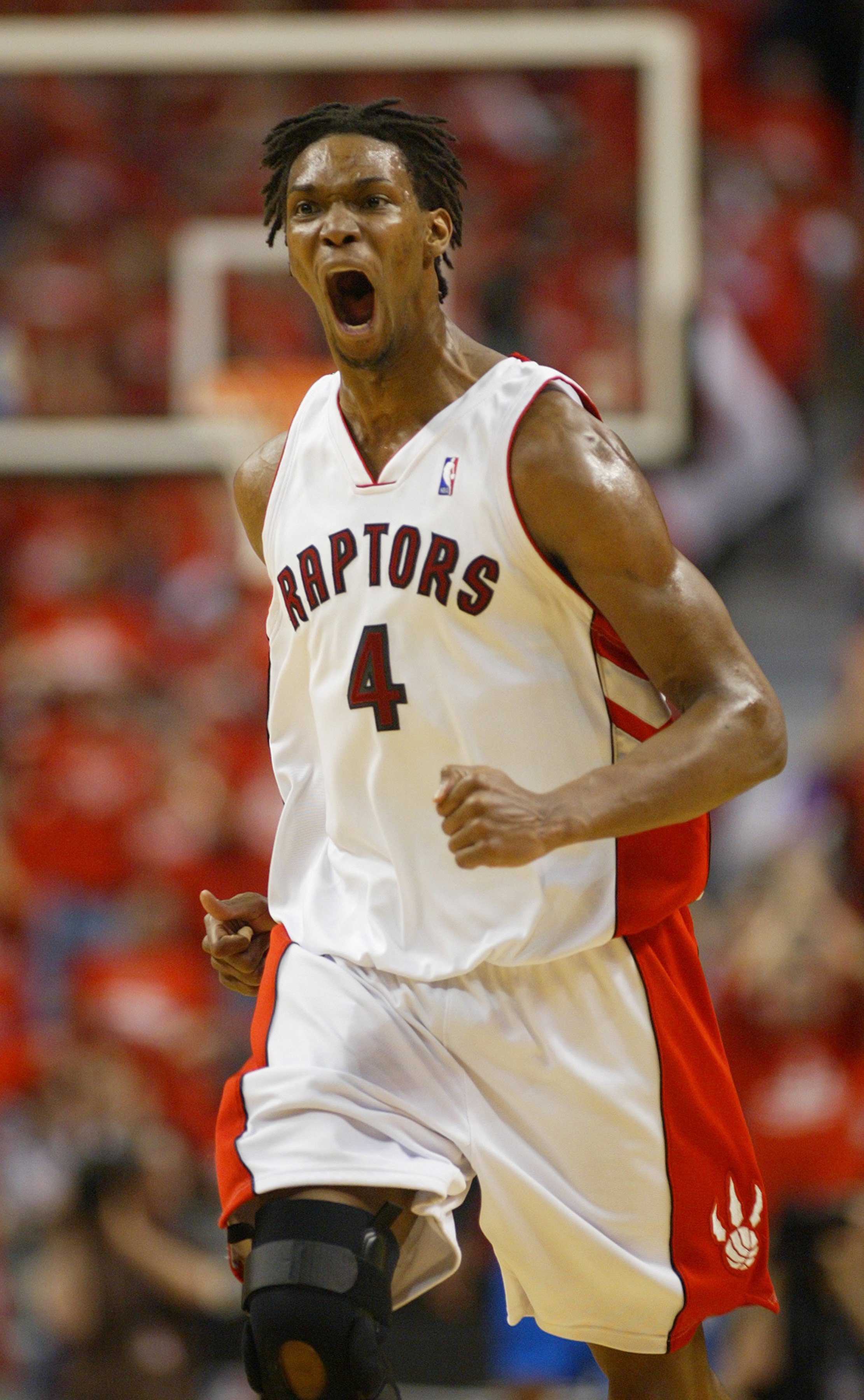TORONTO,ON - APRIL 24:  Chris Bosh #4 of the Toronto Raptors shows his excitement against the Orlando Magic in Game 3 of the Eastern Conference Quarterfinals on April 24, 2008 at the Air Canada Centre in Toronto, Ontario. The Raptors defeated the Magic 10