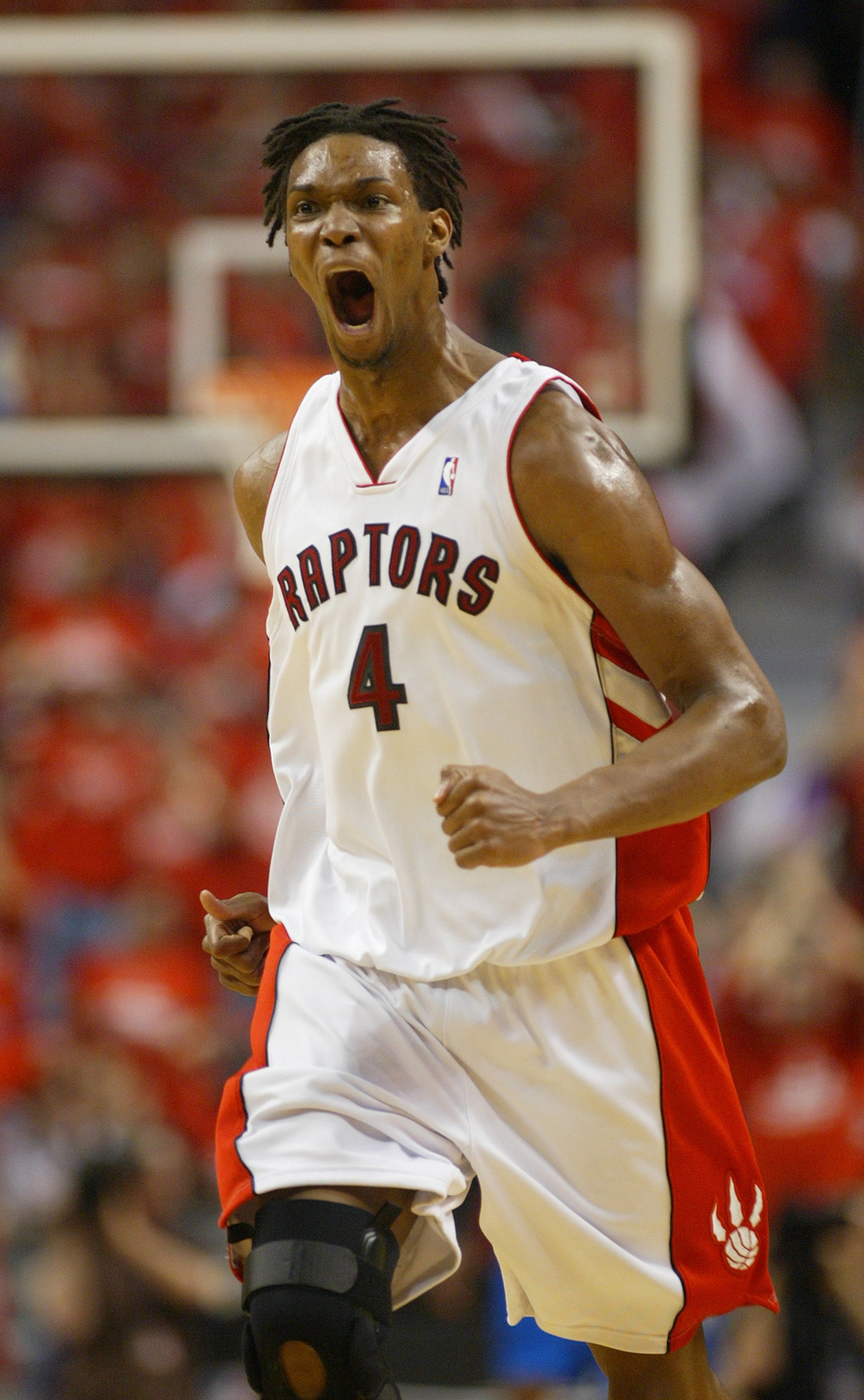 TORONTO,ON - APRIL 24:  Chris Bosh #4 of the Toronto Raptors shows his excitement against the Orlando Magic in Game 3 of the Eastern Conference Quarterfinals on April 24, 2008 at the Air Canada Centre in Toronto, Ontario. The Raptors defeated the Magic 10