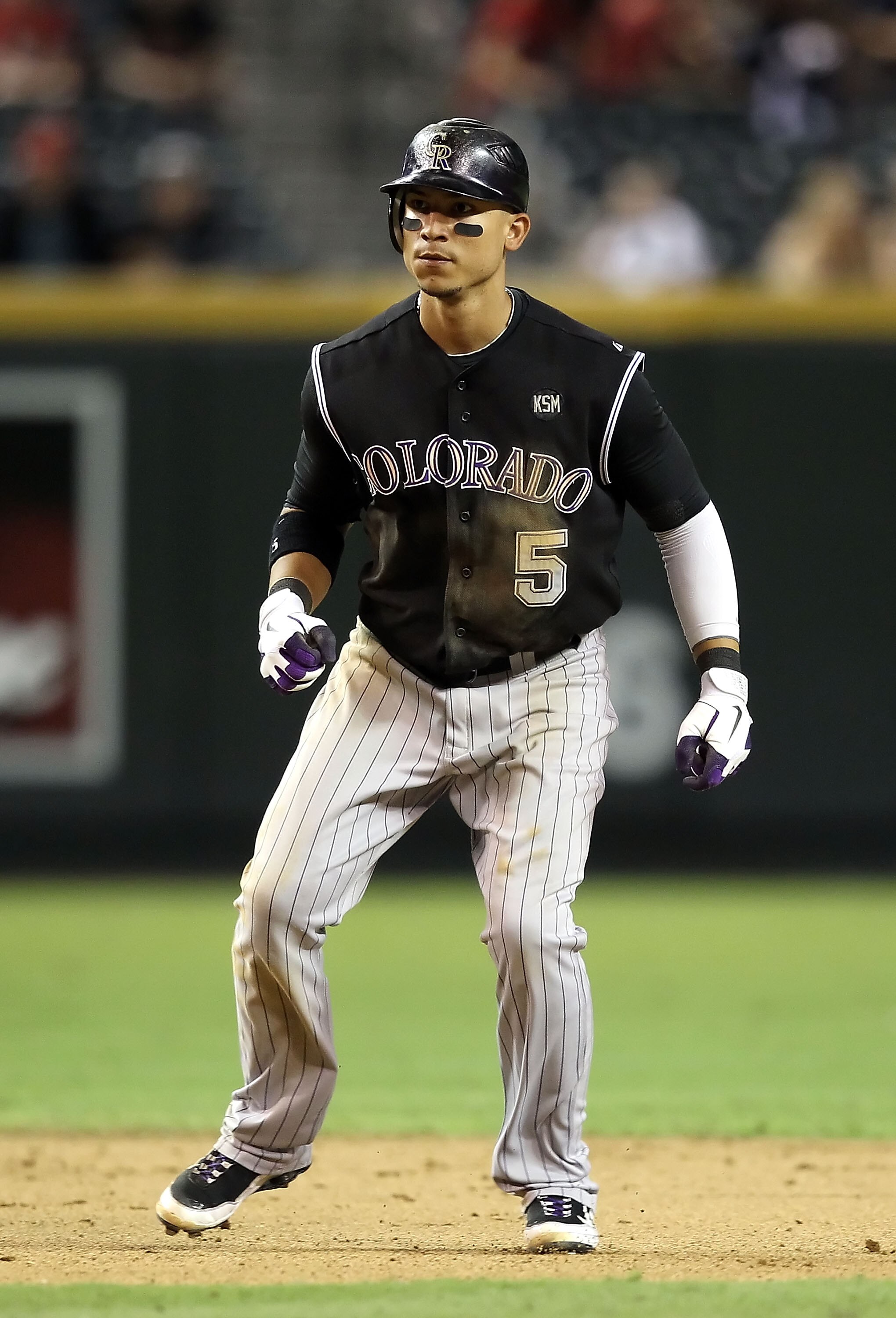 PHOENIX - SEPTEMBER 22:  Carlos Gonzalez #5 of the Colorado Rockies leads off second base during the Major League Baseball game against the Arizona Diamondbacks at Chase Field on September 22, 2010 in Phoenix, Arizona.  (Photo by Christian Petersen/Getty