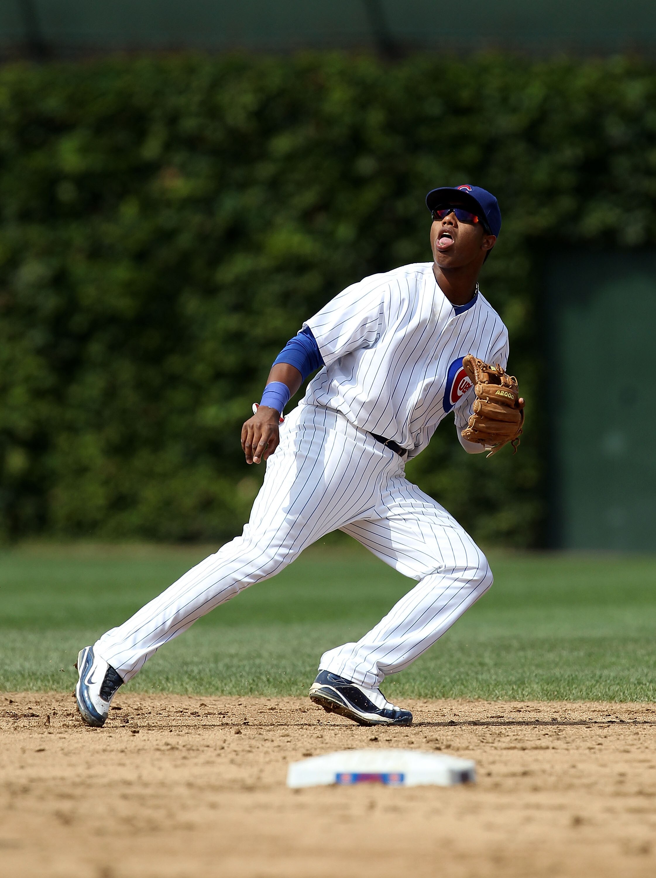 CHICAGO - SEPTEMBER 05: Starlin Castro #13 of the Chicago Cubs chases a fly ball against the New York Mets at Wrigley Field on September 5, 2010 in Chicago, Illinois. The Mets defeated the Cubs 18-5.  (Photo by Jonathan Daniel/Getty Images)