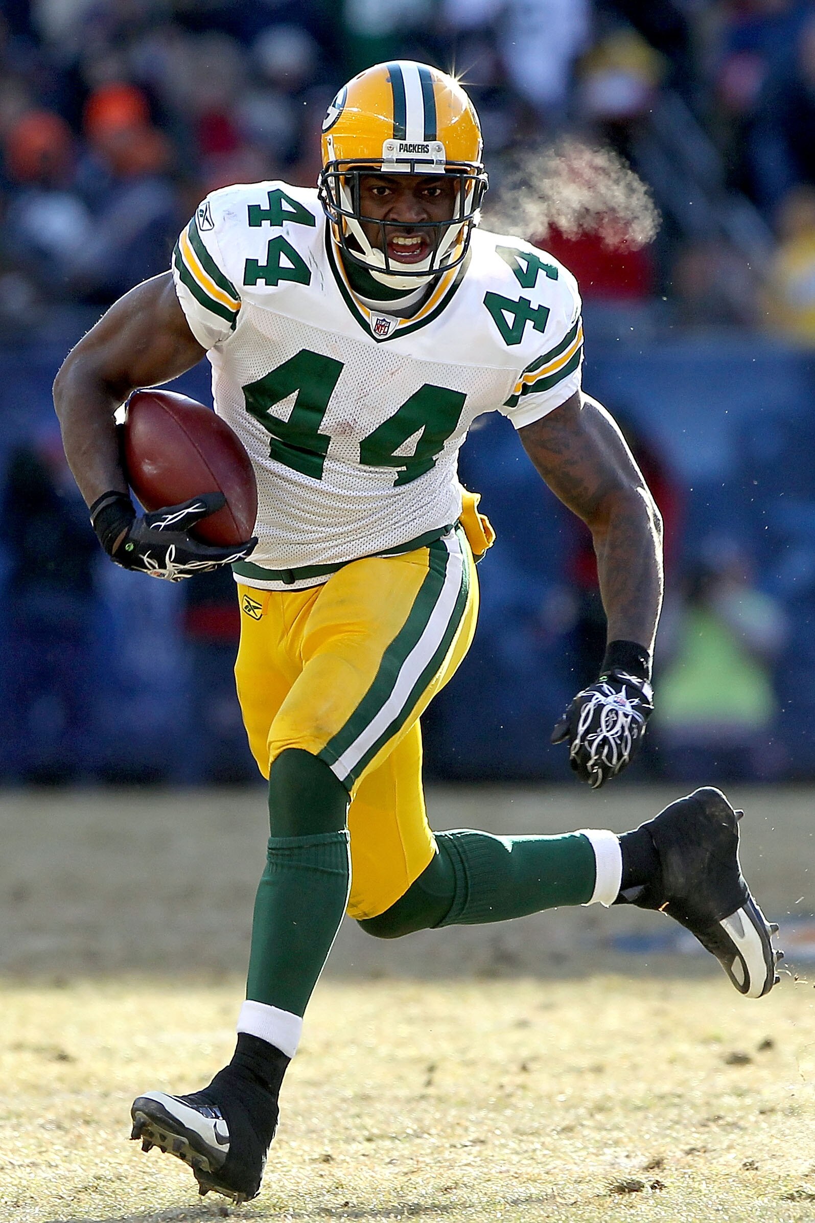 CHICAGO, IL - JANUARY 23:  Running back James Starks #44 of the Green Bay Packers runs the ball against the Chicago Bears in the first half of the NFC Championship Game at Soldier Field on January 23, 2011 in Chicago, Illinois.  (Photo by Doug Pensinger/G