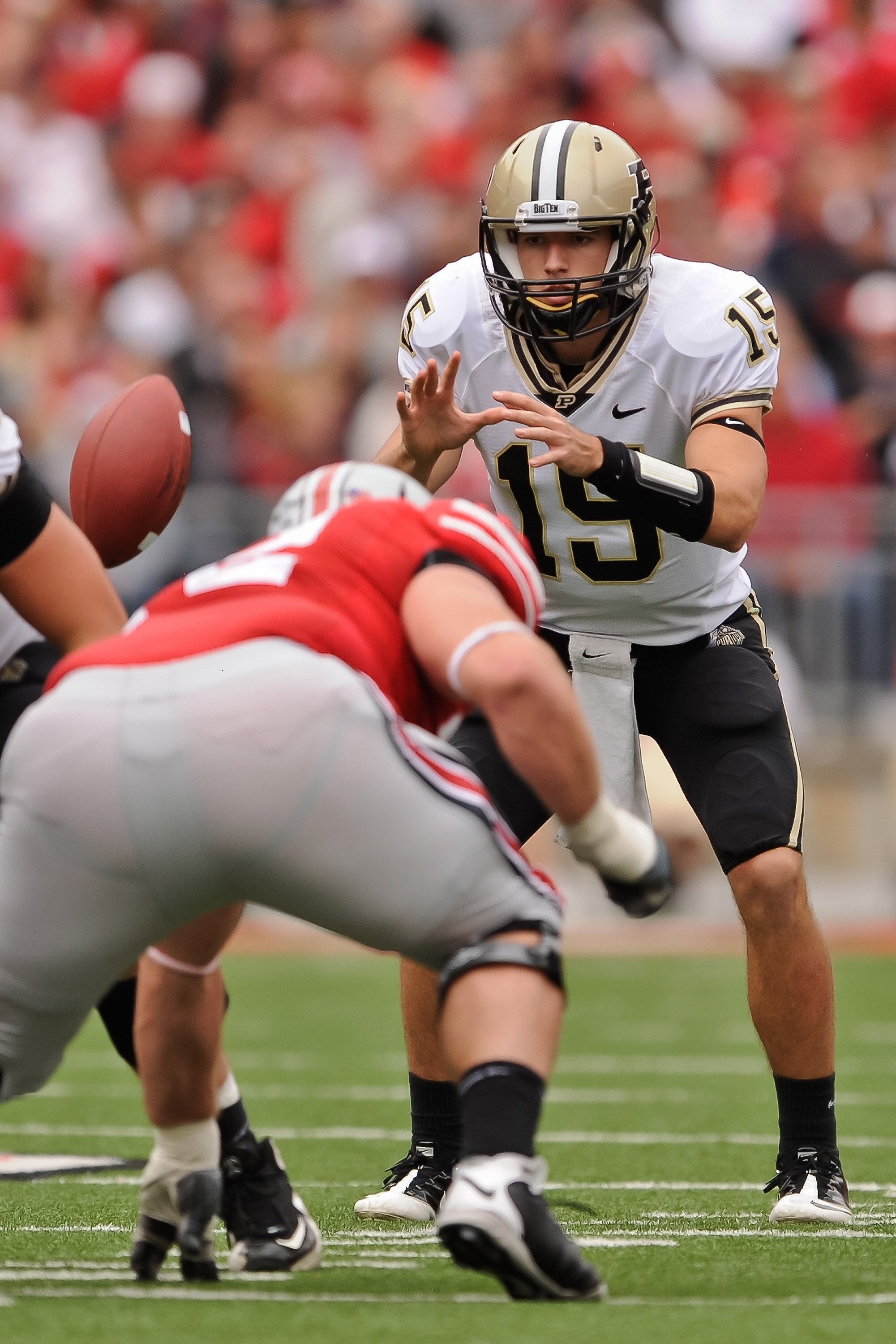 COLUMBUS, OH - OCTOBER 23:  Quarterback Rob Henry #15 of the Purdue Boilermakers takes the snap against the Ohio State Buckeyes at Ohio Stadium on October 23, 2010 in Columbus, Ohio.  (Photo by Jamie Sabau/Getty Images)