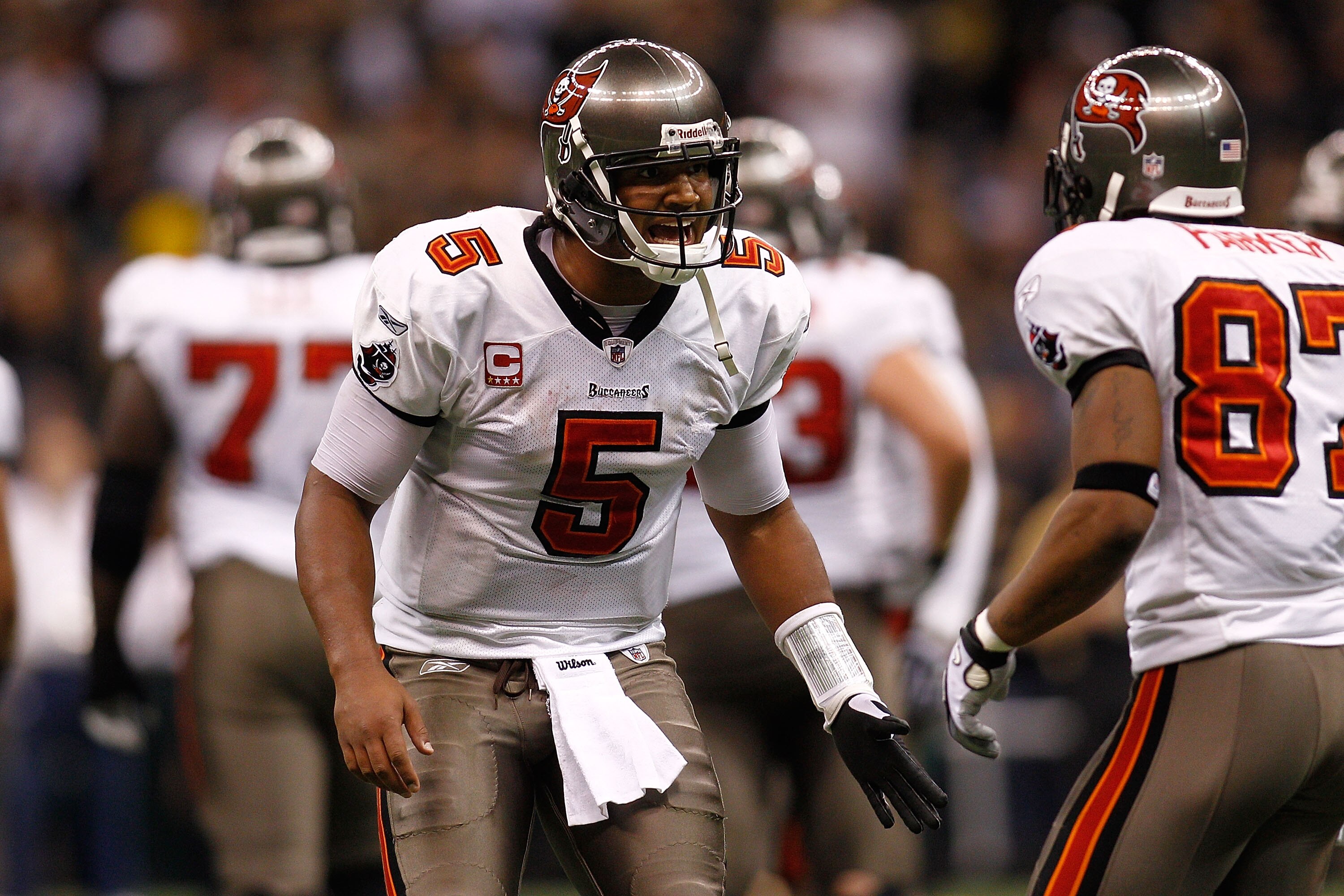 NEW ORLEANS, LA - JANUARY 02:  Quarterback Josh Freeman #5 talks with Preston Parker #87 of the Tampa Bay Buccaneers during the game against the New Orleans Saints at the Louisiana Superdome on January 2, 2011 in New Orleans, Louisiana.   The Buccaneers d
