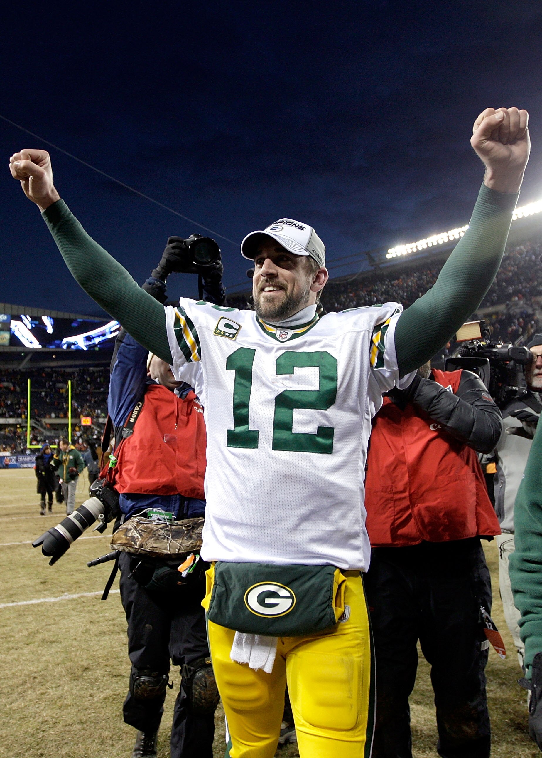 CHICAGO, IL - JANUARY 23:  Quarterback Aaron Rodgers #12 of the Green Bay Packers celebrates the Packers 21-14 victory against the Chicago Bears in the NFC Championship Game at Soldier Field on January 23, 2011 in Chicago, Illinois.  (Photo by Jamie Squir