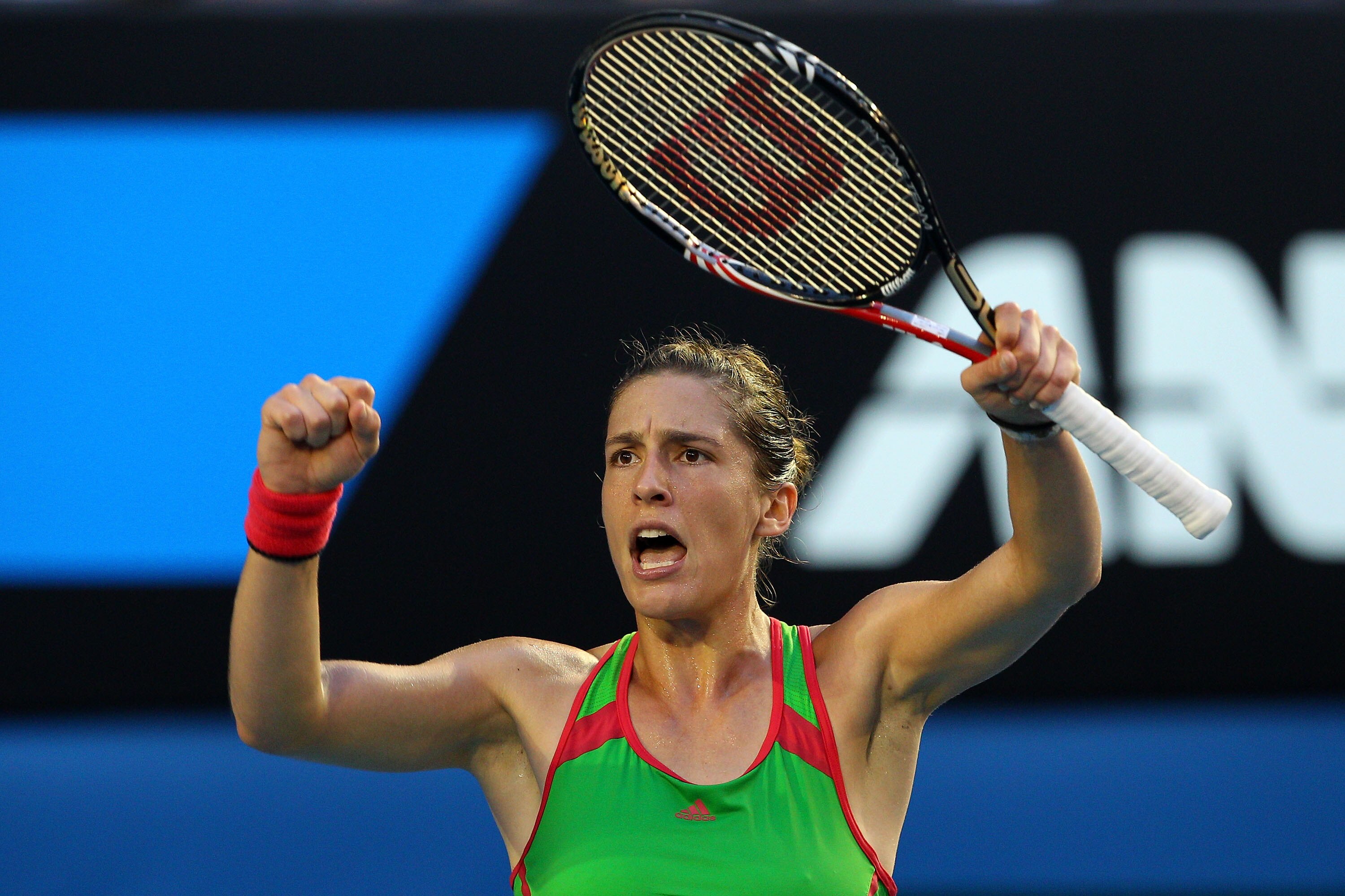 MELBOURNE, AUSTRALIA - JANUARY 23:  Andrea Petkovic of Germany celebrates her match point after winning her fourth round match against Maria Sharapova of Russia during day seven of the 2011 Australian Open at Melbourne Park on January 23, 2011 in Melbourn