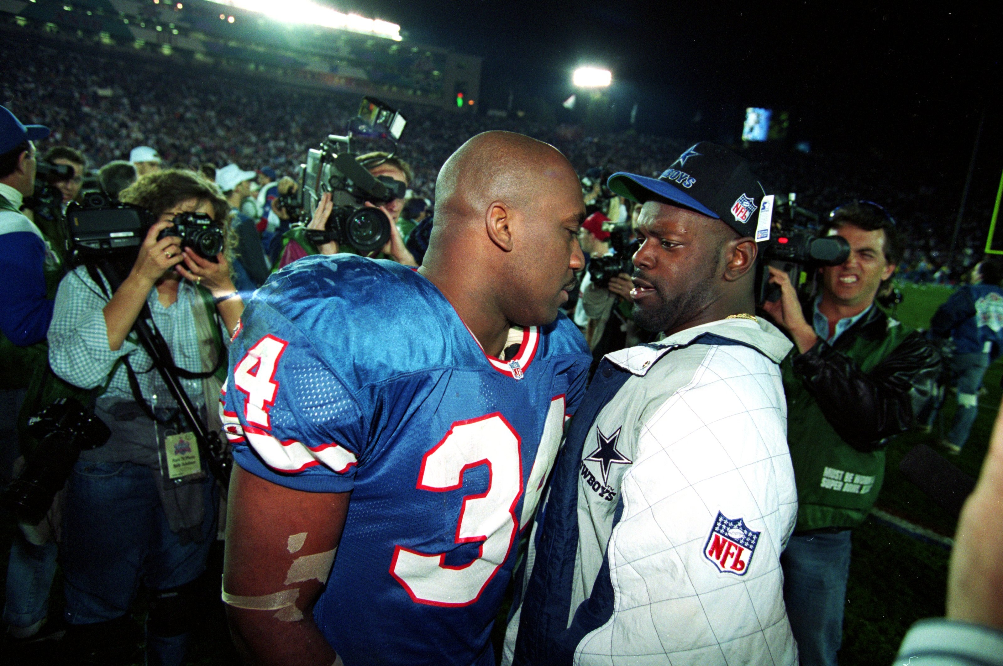 31 Jan 1993:  Emmitt Smith #22 of the Dallas Cowboys talks to a Buffalo Bills player after Superbowl XXVII at the Rose Bowl in Pasadena, California. The Cowboys defeated the Bills 52-17. Mandatory Credit: Mike Powell  /Allsport