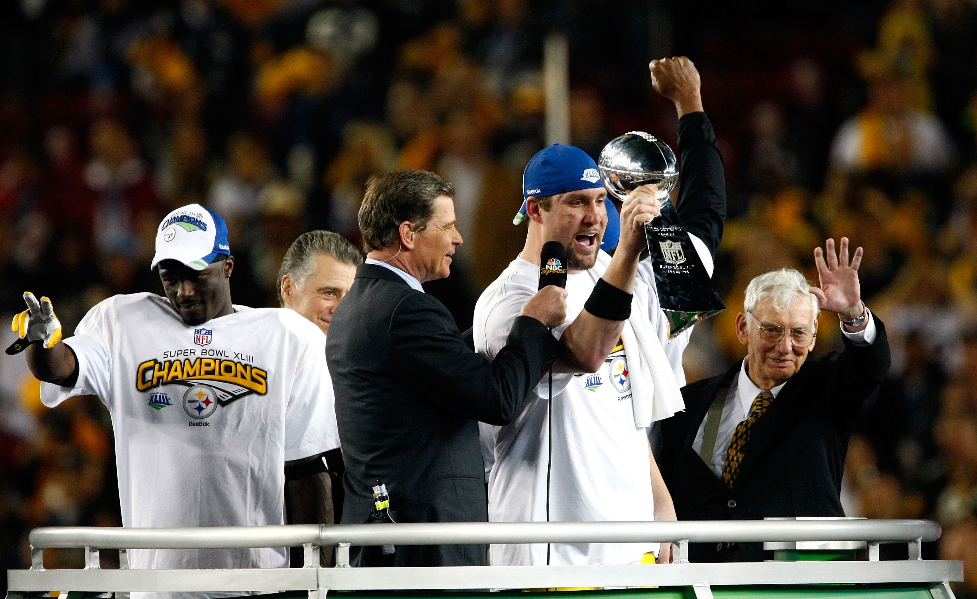 TAMPA, FL - FEBRUARY 01:  Santonio Holmes #10, Ben Roethlisberger #7 and team owner Dan Rooney of the Pittsburgh Steelers celebrate with the Vince Lonbardi trophy after the defeated the Arizona Cardinals 27-23 during Super Bowl XLIII on February 1, 2009 a