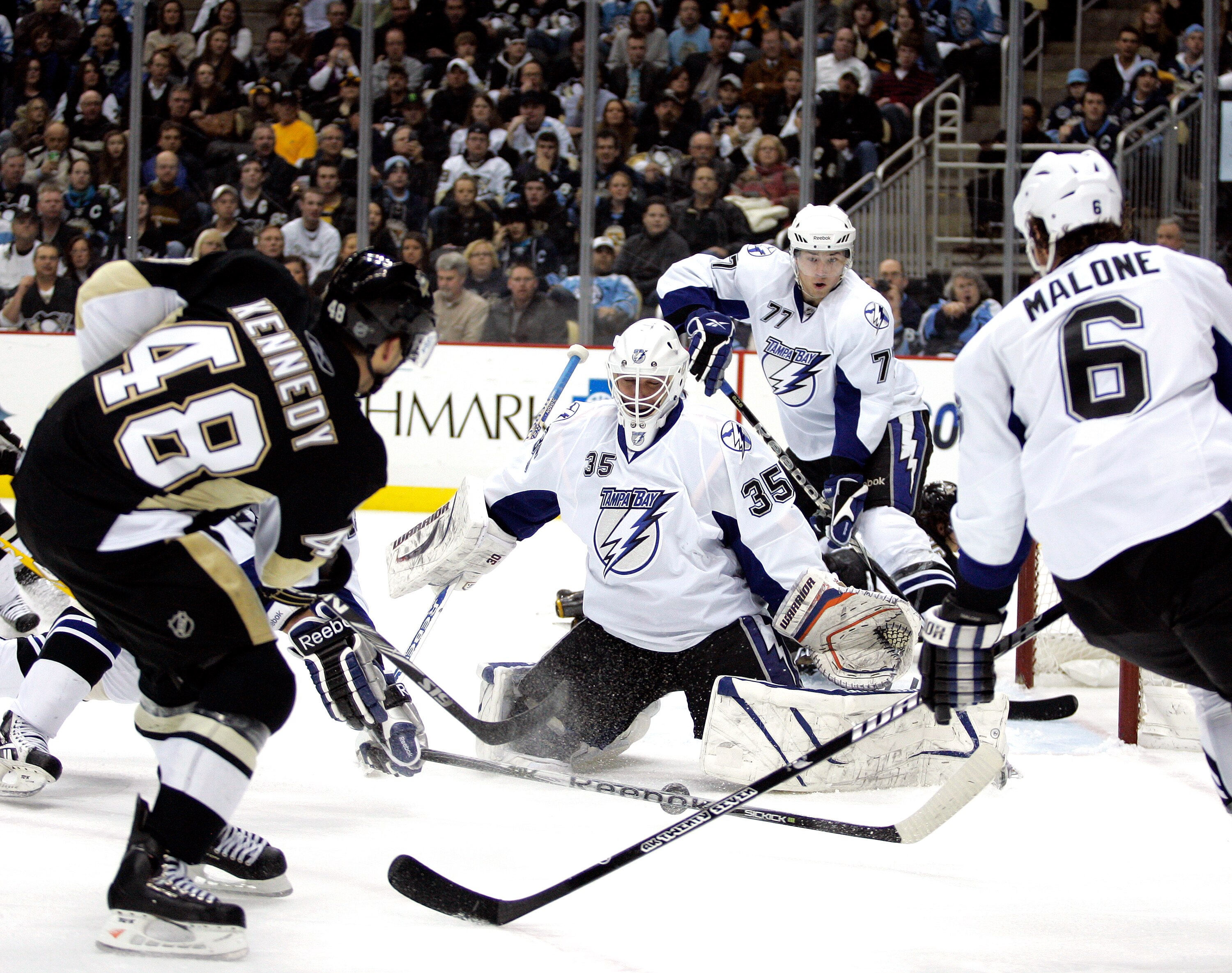 PITTSBURGH, PA - JANUARY 05:  Tyler Kennedy #48 of the Pittsburgh Penguins shoots and scores past Dwayne Roloson #35 of the Tampa Bay Lightning on January 5, 2011 at Consol Energy Center in Pittsburgh, Pennsylvania.  (Photo by Justin K. Aller/Getty Images