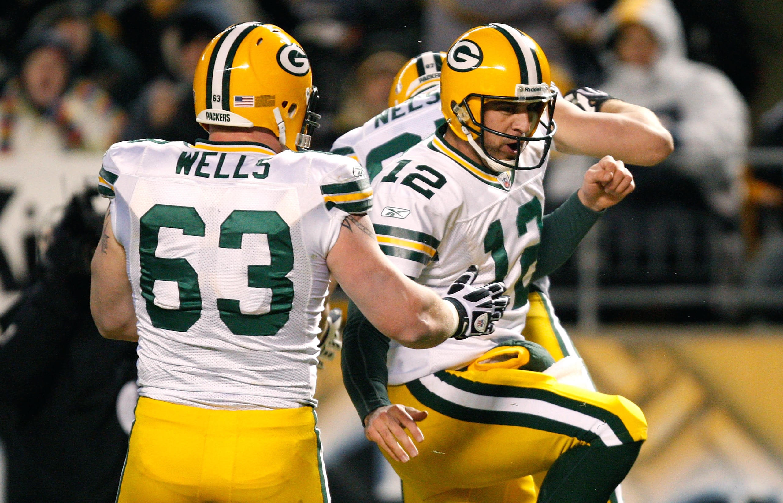 PITTSBURGH - DECEMBER 20: Aaron Rodgers #12 celebrates with Jordy Nelson #87 and Scott Wells #63 of the Green Bay Packers after running in for a touchdown against the Pittsburgh Steelers during the game on December 20, 2009 at Heinz Field in Pittsburgh, P
