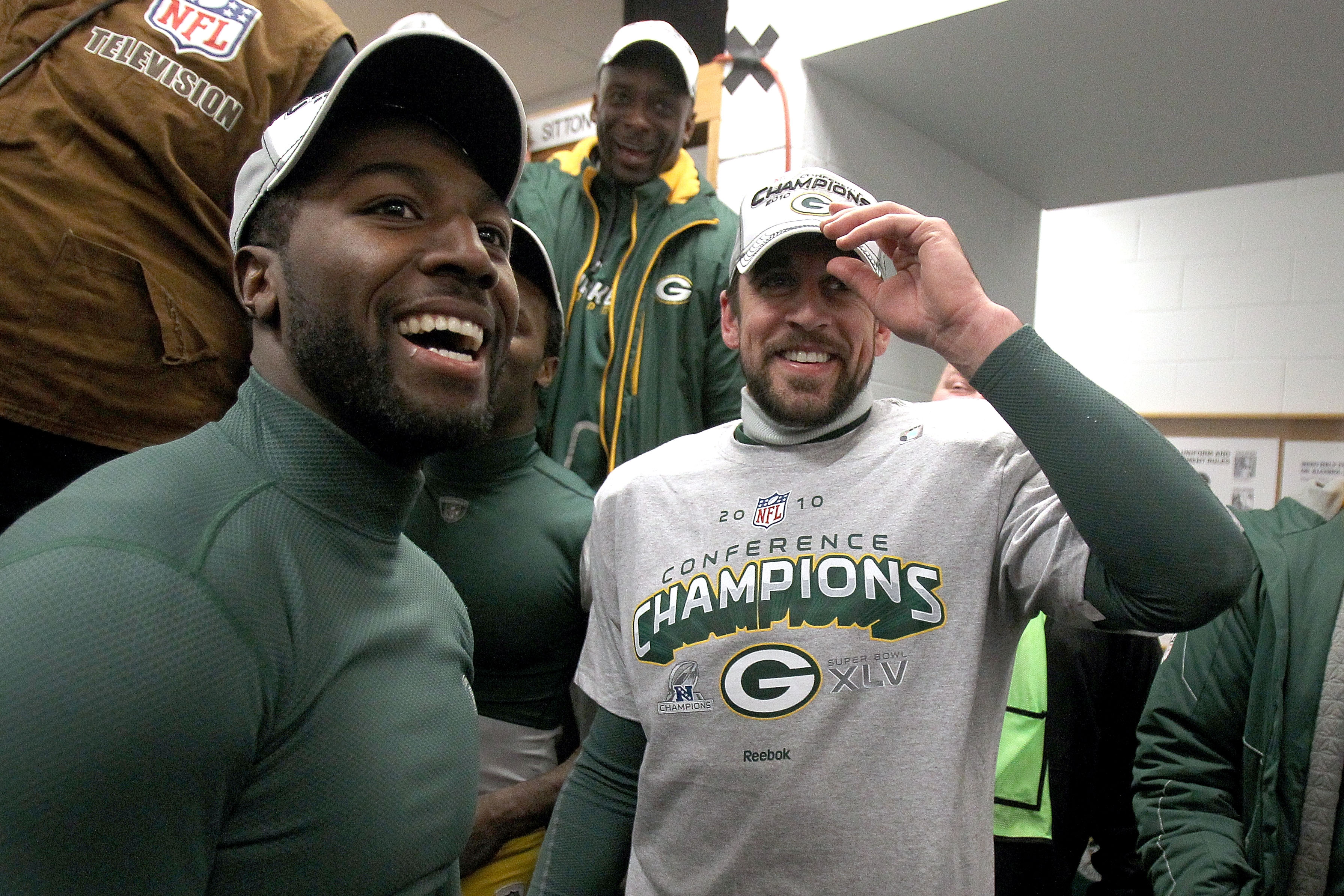 CHICAGO, IL - JANUARY 23: (R-L) Quarterback Aaron Rodgers #12 and Greg Jennings #85 of the Green Bay Packers celebrate the Packers 21-14 victory against the Chicago Bears in the NFC Championship Game at Soldier Field on January 23, 2011 in Chicago, Illin CHICAGO, IL - JANUARY 23: (R-L) Quarterback Aaron Rodgers #12 and Greg Jennings #85 of the Green Bay Packers celebrate the Packers 21-14 victory against the Chicago Bears in the NFC Championship Game at Soldier Field on January 23, 2011 in Chicago, Illin