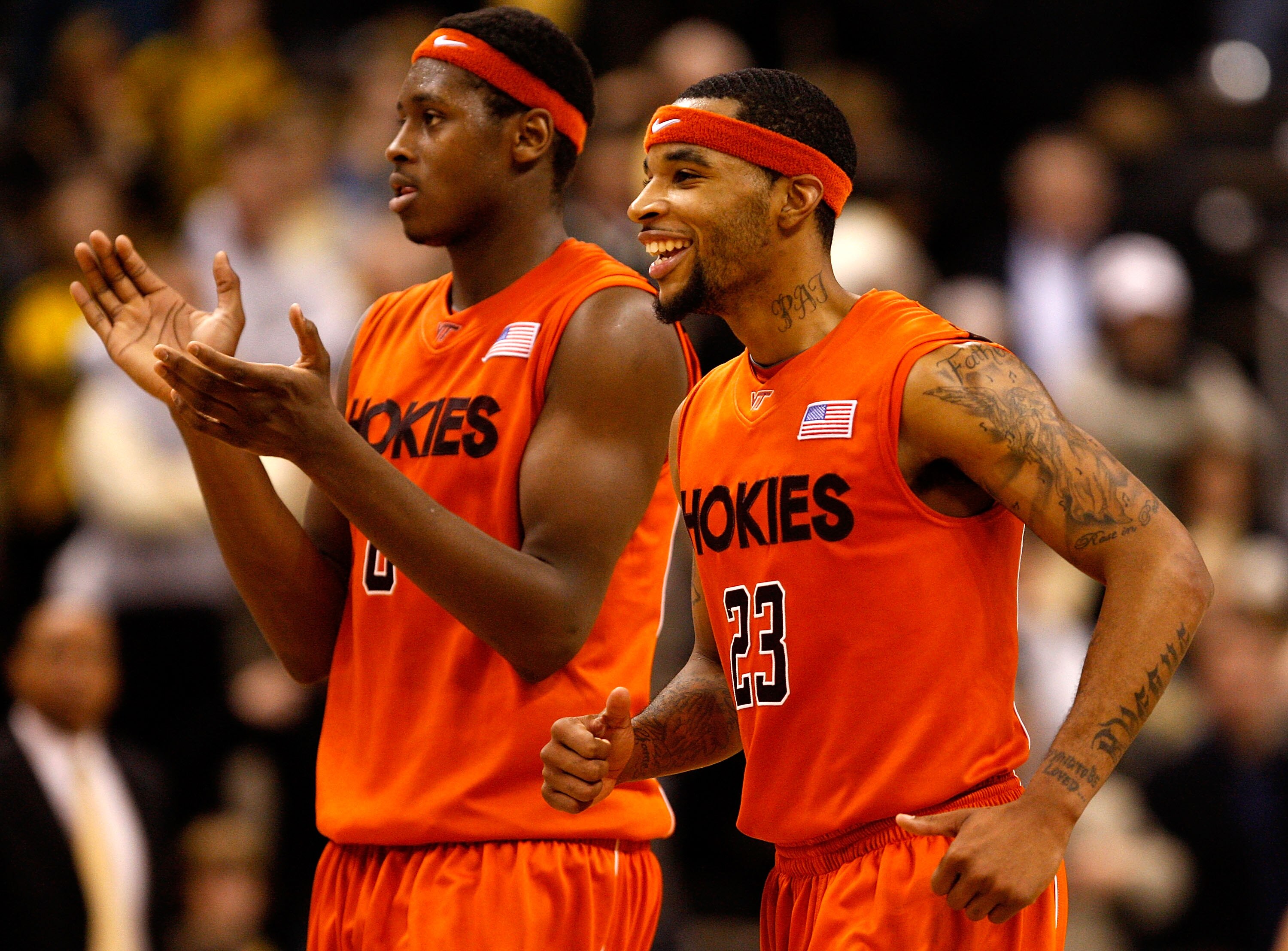 WINSTON-SALEM, NC - JANUARY 21:  Malcolm Delaney #23 and teammate Jeff Allen #0 of the Virginia Tech Hokies celebrate as they run to the bench against the Wake Forest Demon Deacons during their game at Lawrence Joel Coliseum on January 21, 2009 in Winston