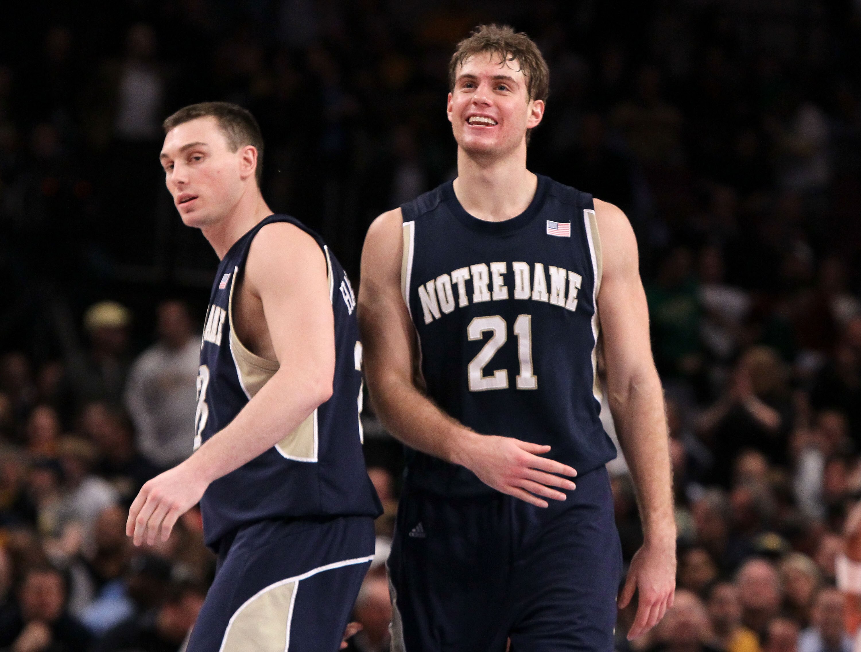 NEW YORK - MARCH 11: Ben Hansbrough #23 and Tim Abromaitis #21 of the Notre Dame Fighting Irish react after defeating the Pittsburgh Panthers during the quarterfinal of the 2010 NCAA Big East Tournament at Madison Square Garden on March 11, 2010 in New Yo