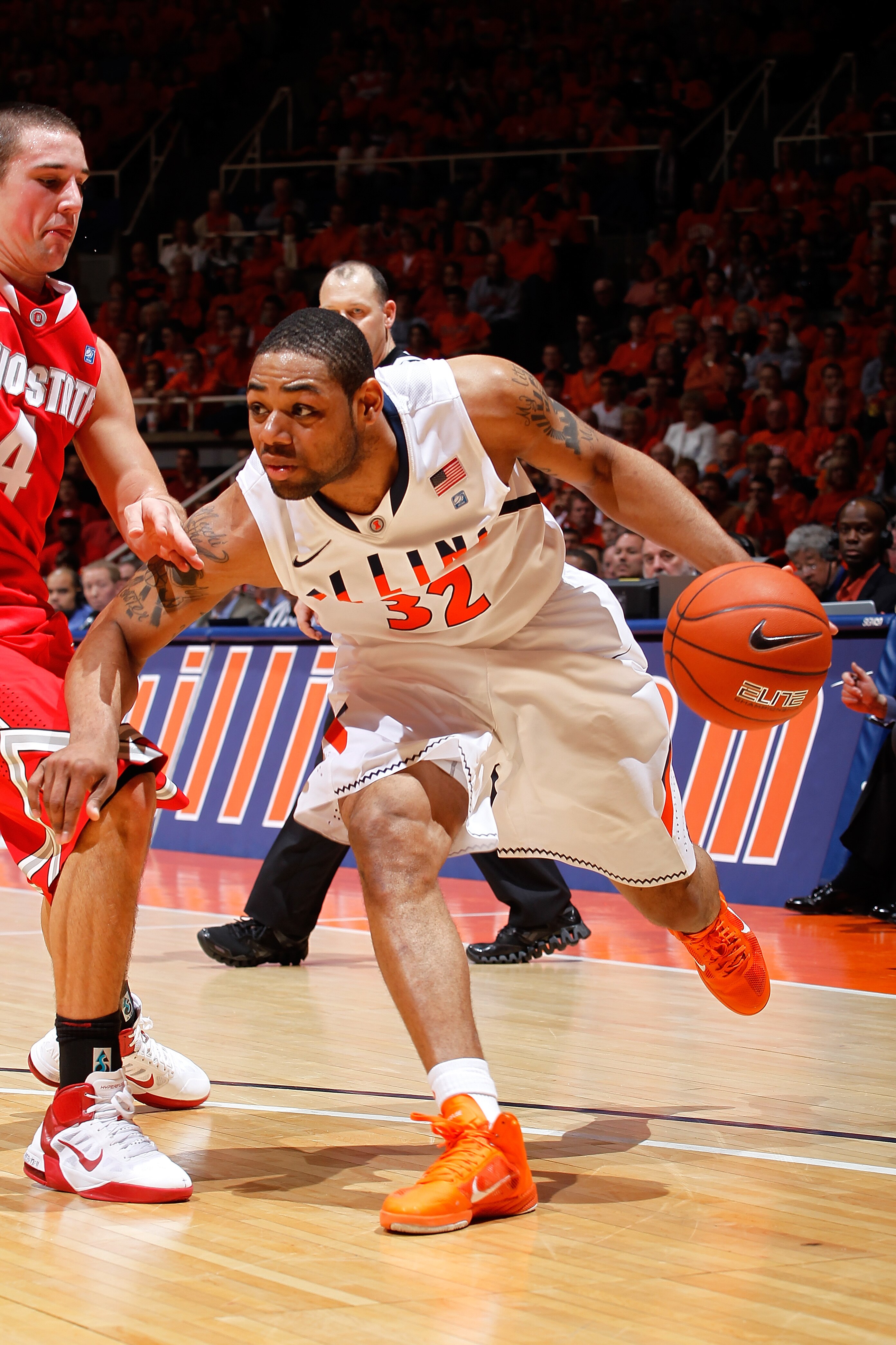CHAMPAIGN, IL - JANUARY 22: Demetri McCamey #32 of the Illinois Fighting Illini tries to get to the basket while being defended by Aaron Craft #4 of the Ohio State Buckeyes at Assembly Hall on January 22, 2011 in Champaign, Illinois. Ohio State won 73-68.
