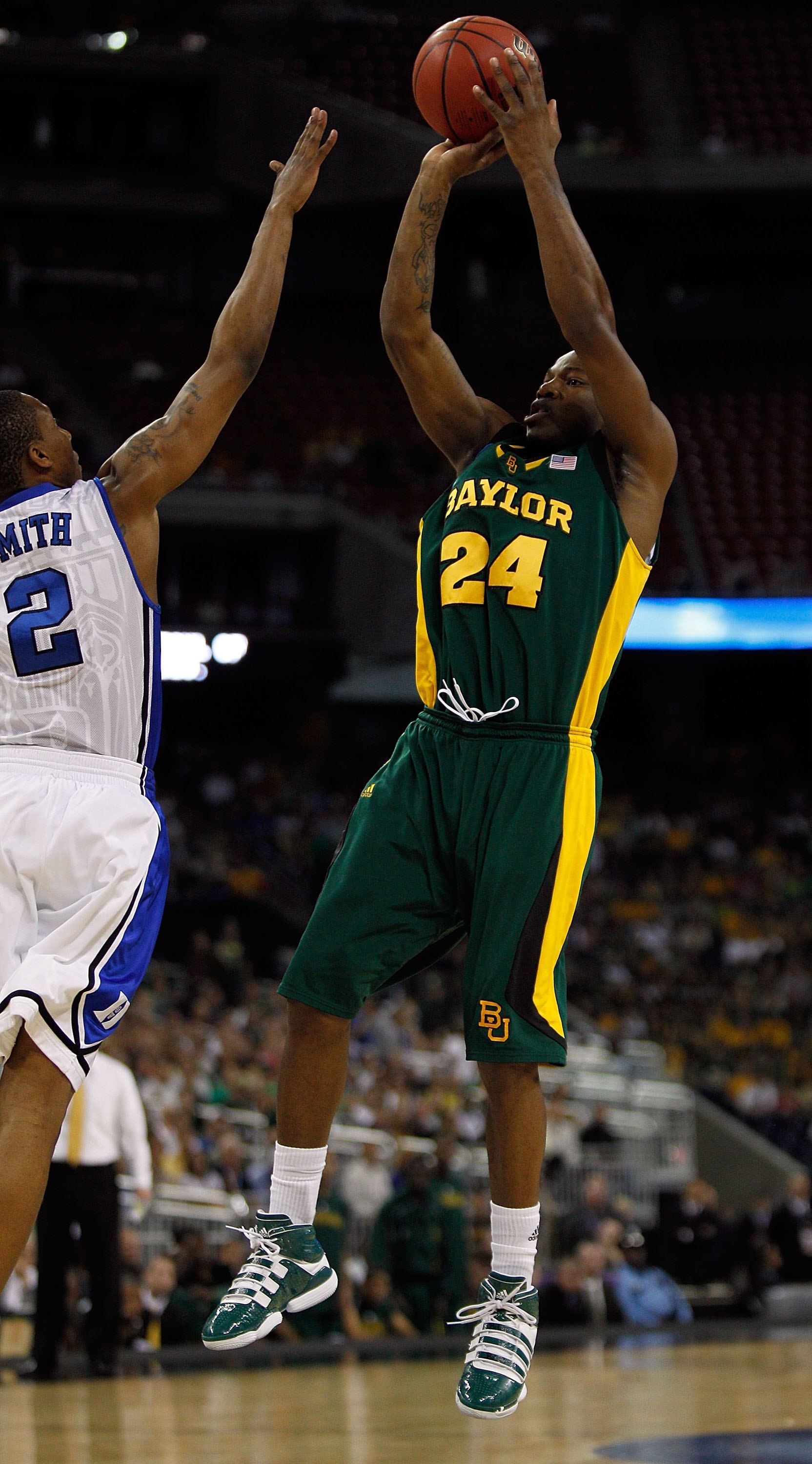 HOUSTON - MARCH 28: LaceDarius Dunn #24 of the Baylor Bears puts up a shot over Nolan Smith #2 of the Duke Blue Devils during the south regional final of the 2010 NCAA men's basketball tournament at Reliant Stadium on March 28, 2010 in Houston, Texas. Duk