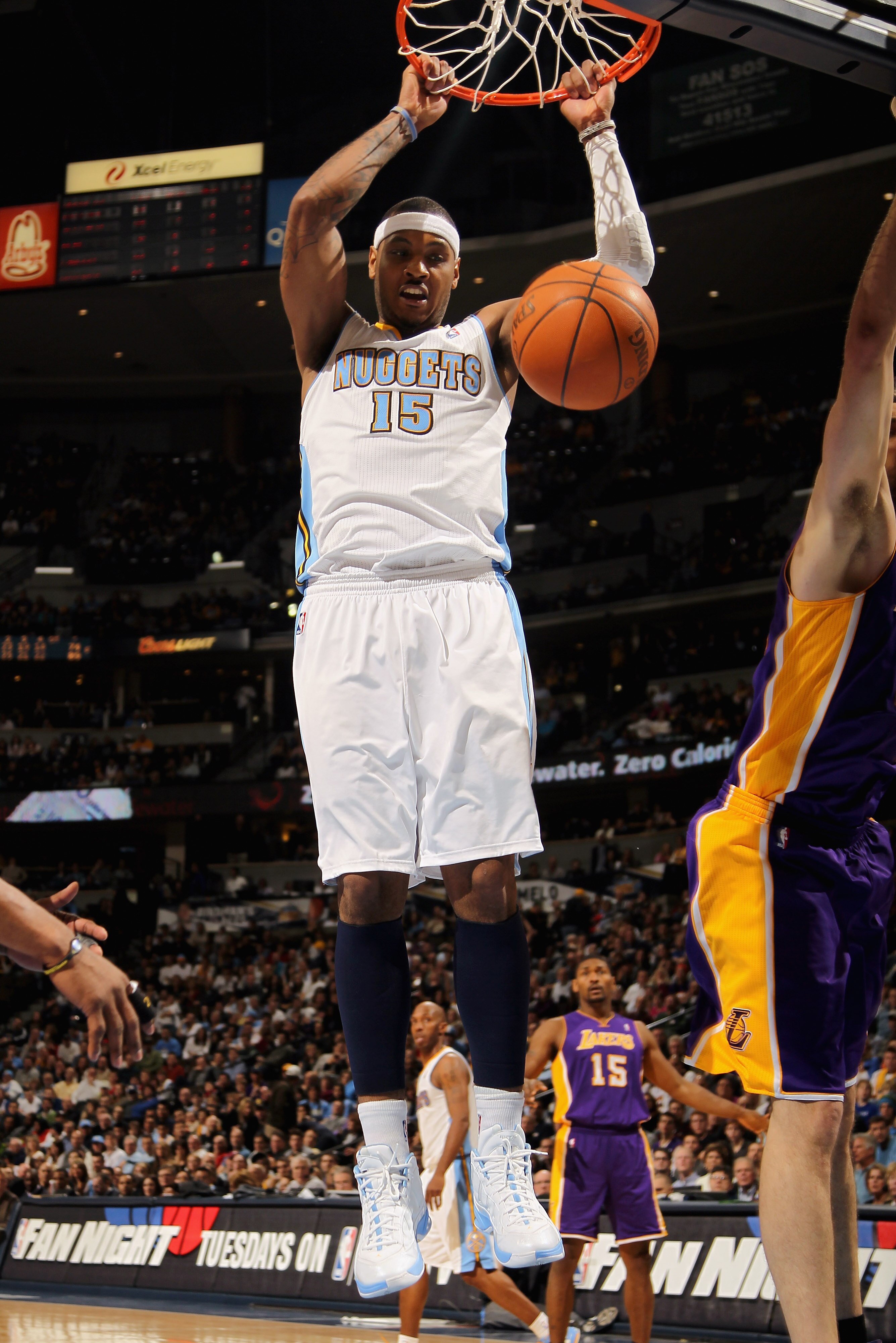 DENVER, CO - JANUARY 21:  Carmelo Anthony #15 of the Denver Nuggets dunks the ball against the Los Angeles Lakers at the Pepsi Center on January 21, 2011 in Denver, Colorado. The Lakers defeated the Nuggets 107-97. NOTE TO USER: User expressly acknowledge
