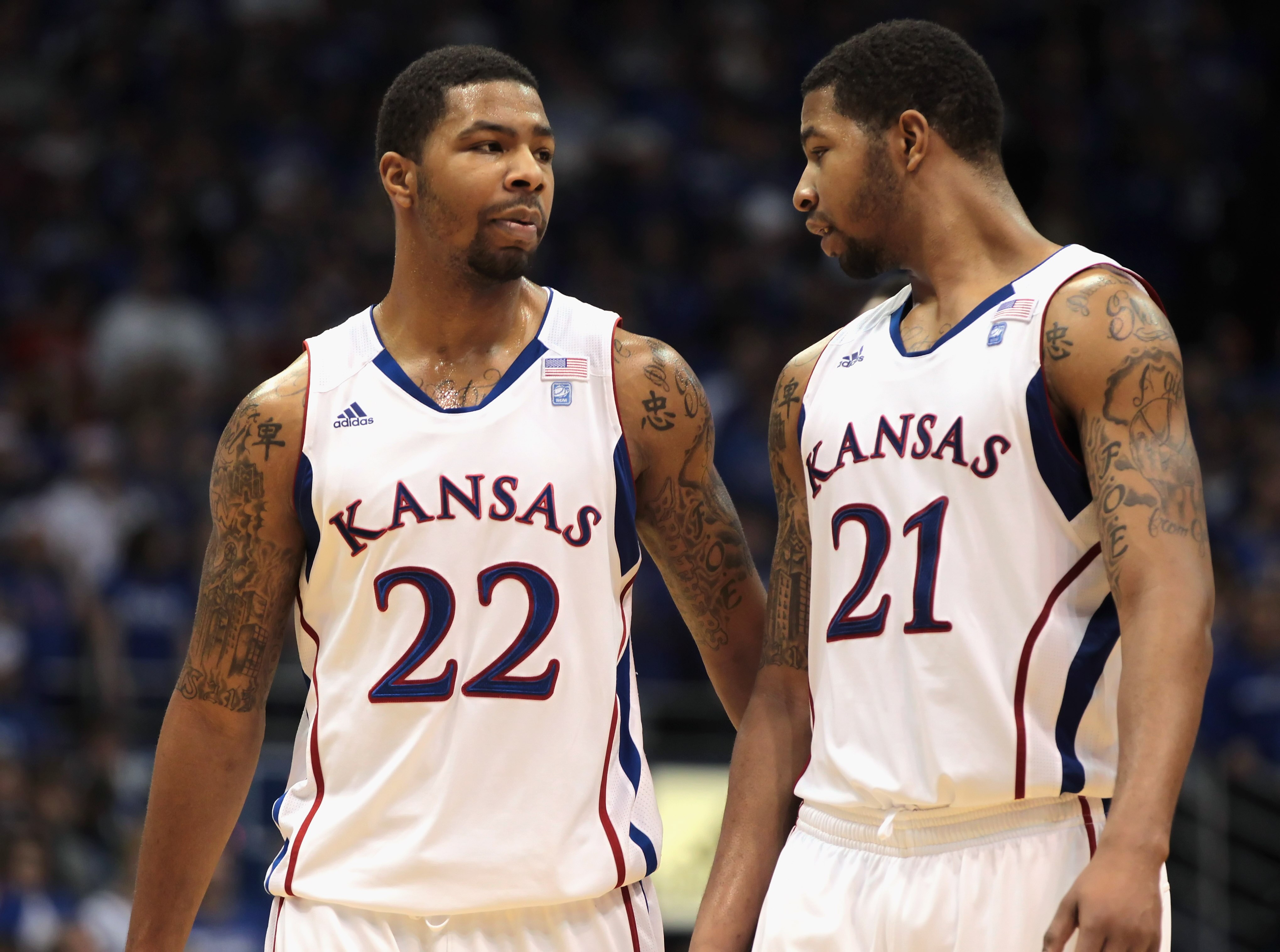 LAWRENCE, KS - DECEMBER 18:  Marcus Morris #22 and Markieff Morris #21 of the Kansas Jayhawks talk during the game against the USC Trojans on December 18, 2010 at Allen Fieldhouse in Lawrence, Kansas.  (Photo by Jamie Squire/Getty Images)