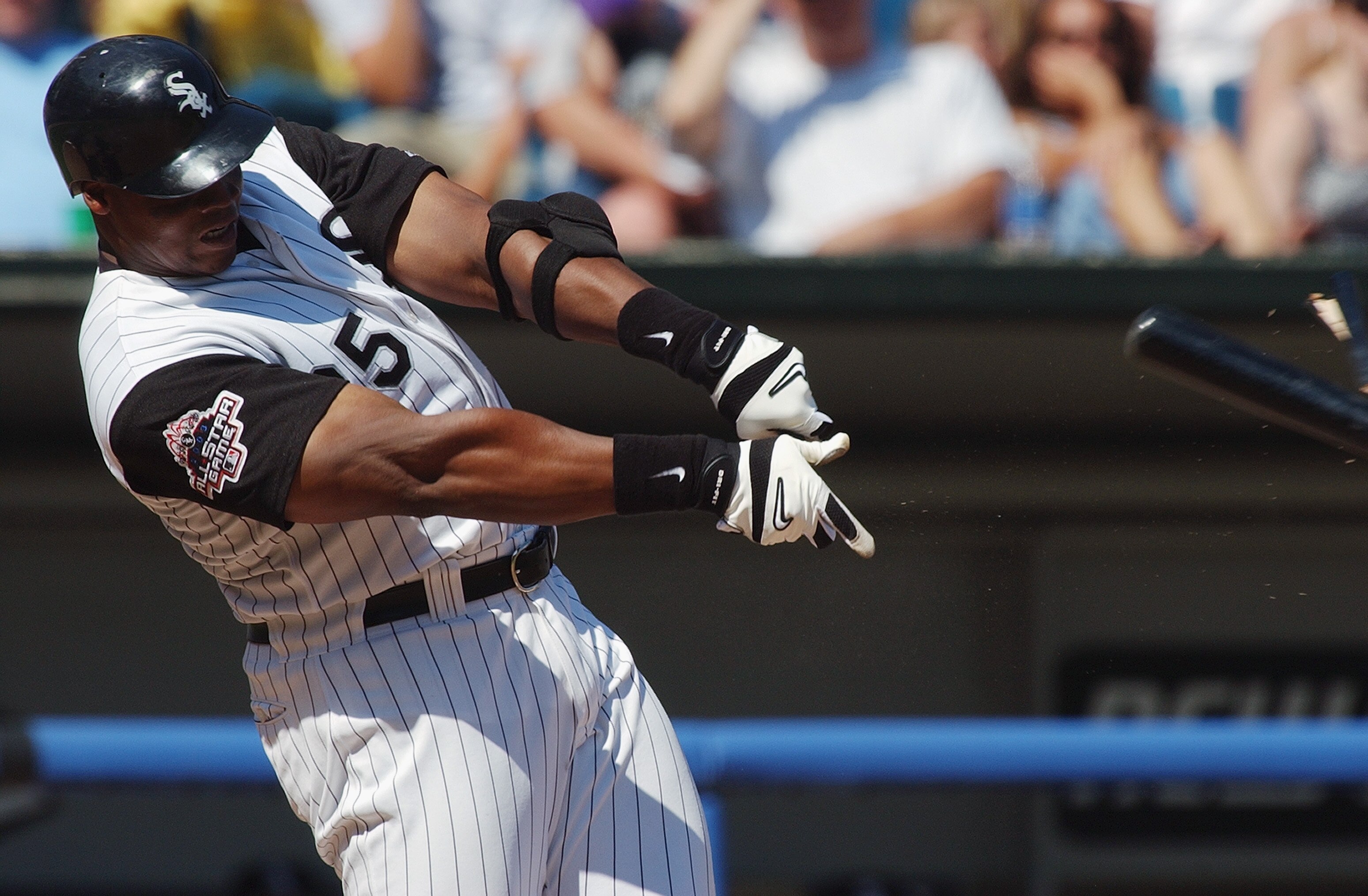 CHICAGO - AUGUST 10:  Designated hitter Frank Thomas #35 of the Chicago White Sox has a broken bat fly out of his hands during his at bat against the Oakland Athletics in the American League game at U.S. Cellular Field on August 10, 2003 in Chicago, Illin