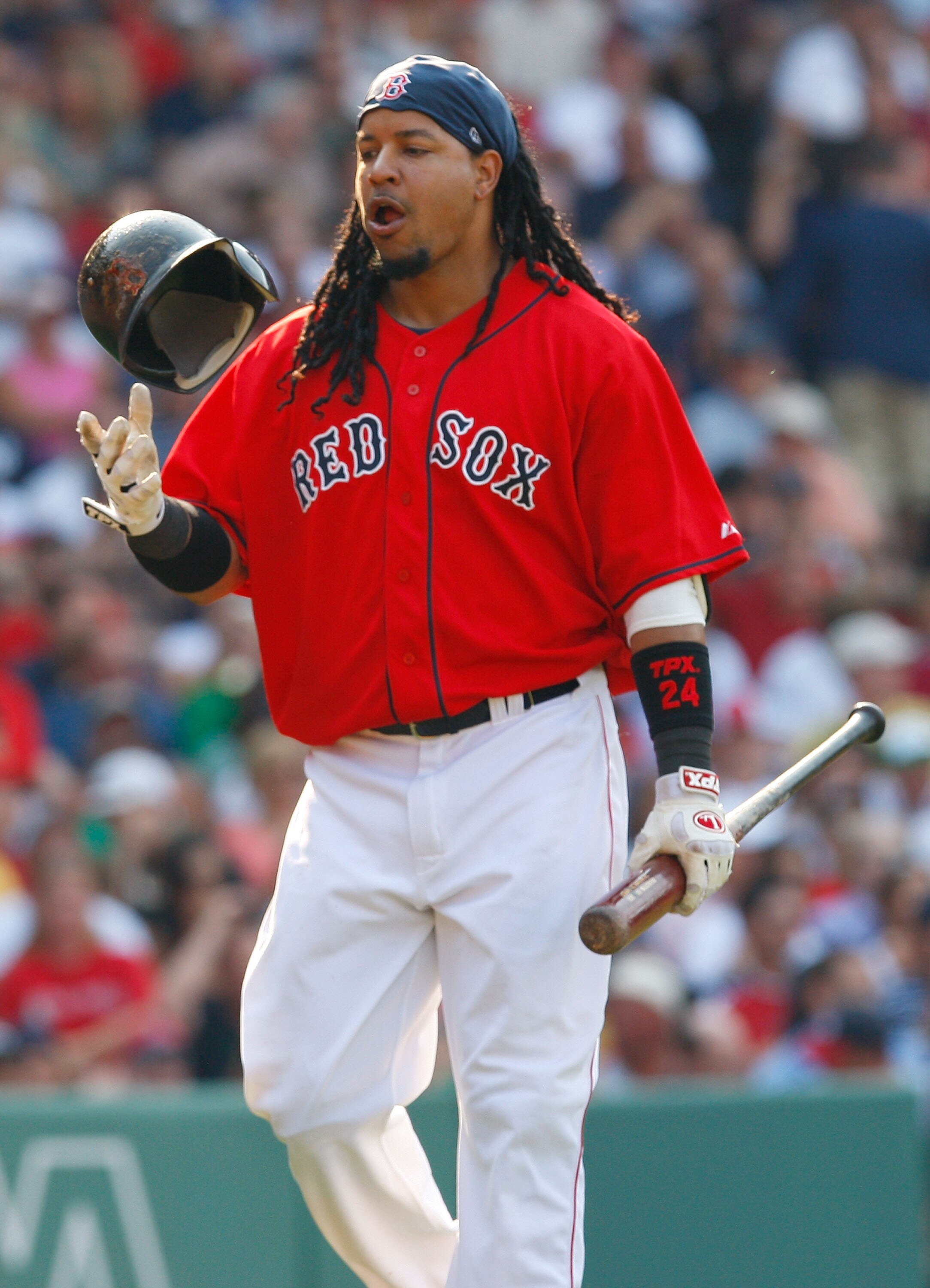 BOSTON - JULY 26: Manny Ramirez #24 of the Boston Red Sox reacts after lining out against the New York Yankees at Fenway Park on July 26, 2008 in Boston, Massachusetts.  (Photo by Jim Rogash/Getty Images)