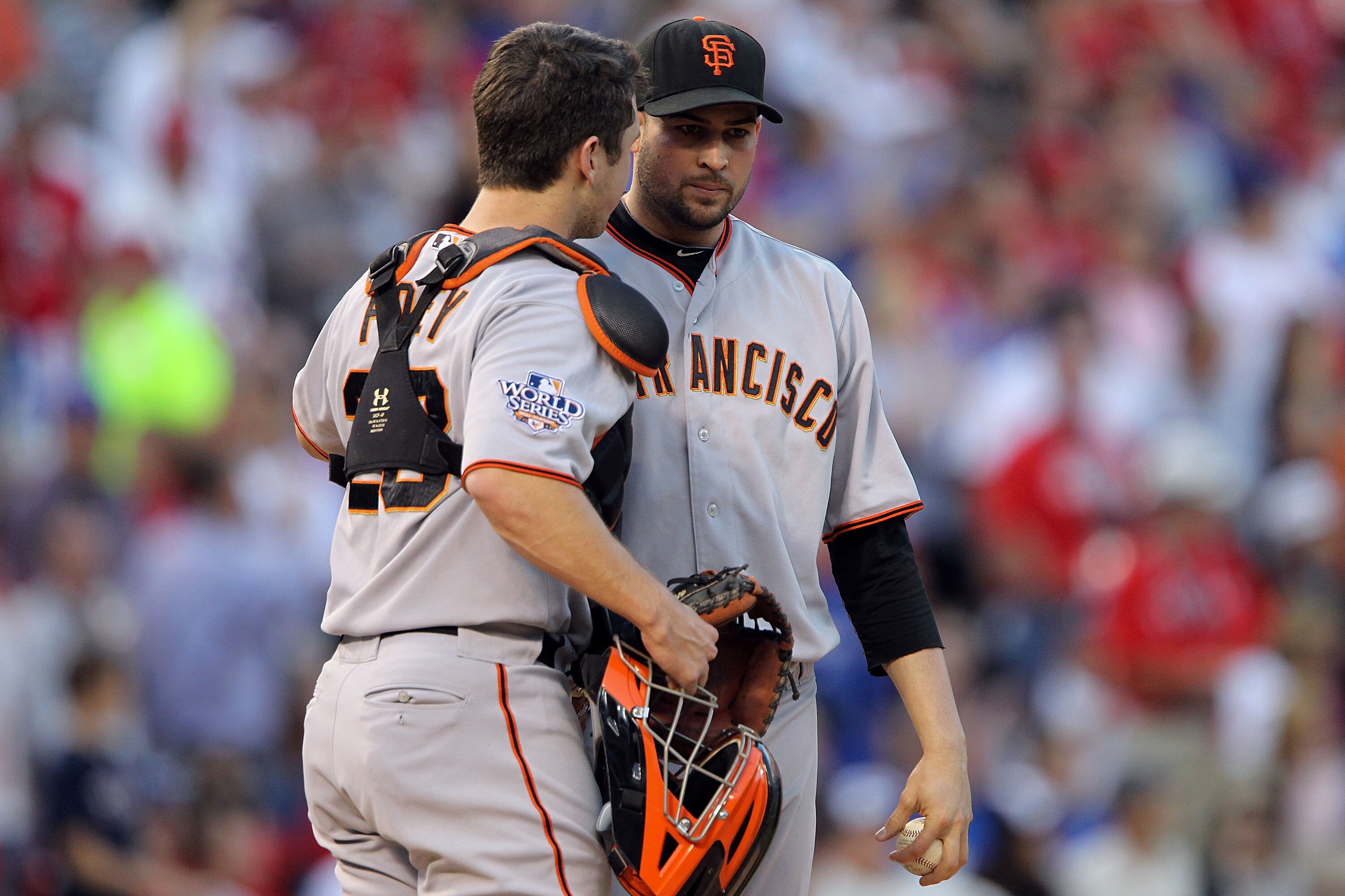 ARLINGTON, TX - OCTOBER 30:  (L-R) Catcher Buster Posey #28 and Jonathan Sanchez #57 of the San Francisco Giants talk during the bottom of the first inning against the Texas Rangers in Game Three of the 2010 MLB World Series at Rangers Ballpark in Arlingt