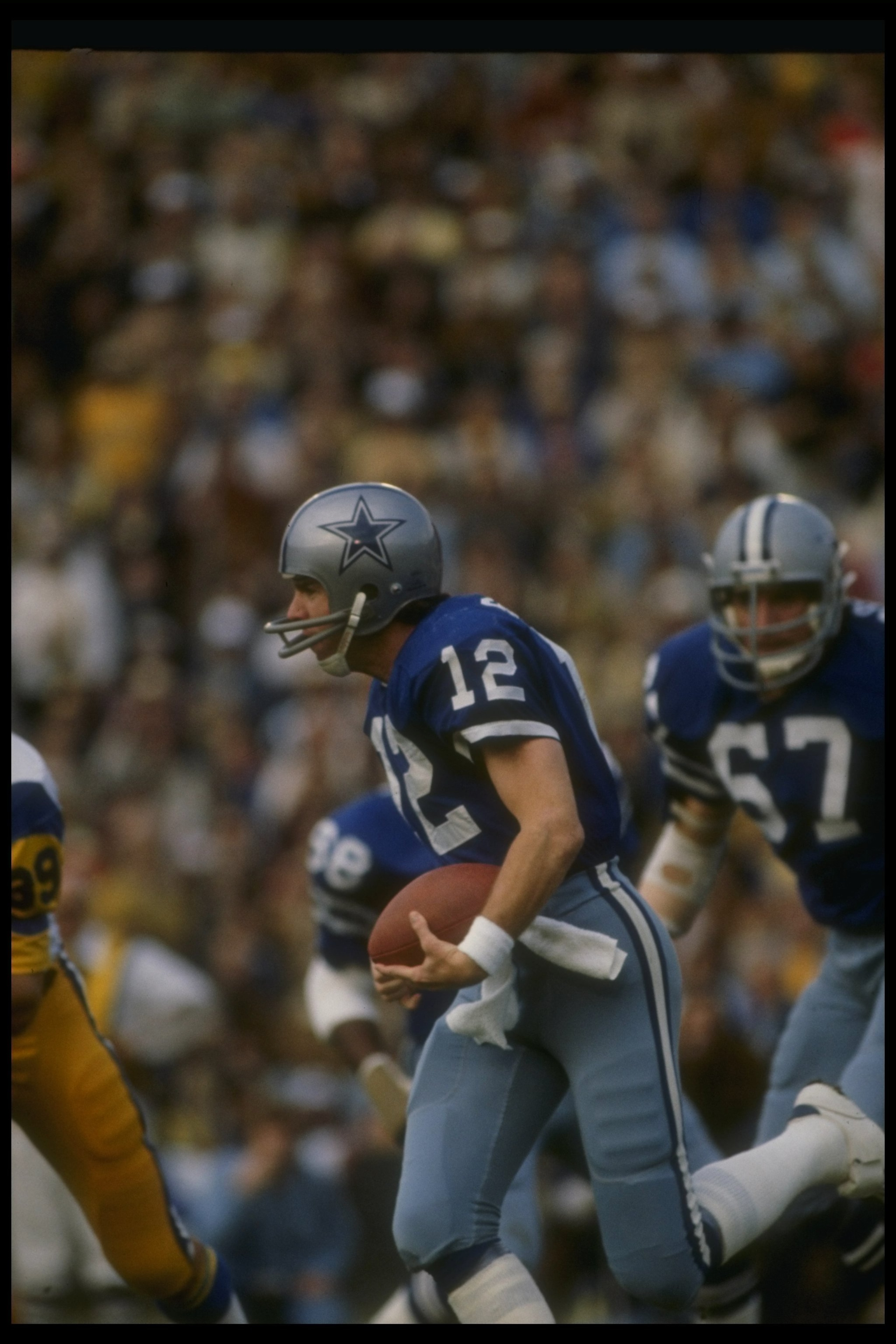 7 Jan 1979: Quarterback Roger Staubach of the Dallas Cowboys moves the ball during a playoff game against the Los Angeles Rams at Anaheim Stadium in Anaheim, California. The Cowboys won the game, 28-0. Mandatory Credit: Allsport /Allsport 7 Jan 1979: Quarterback Roger Staubach of the Dallas Cowboys moves the ball during a playoff game against the Los Angeles Rams at Anaheim Stadium in Anaheim, California. The Cowboys won the game, 28-0. Mandatory Credit: Allsport /Allsport