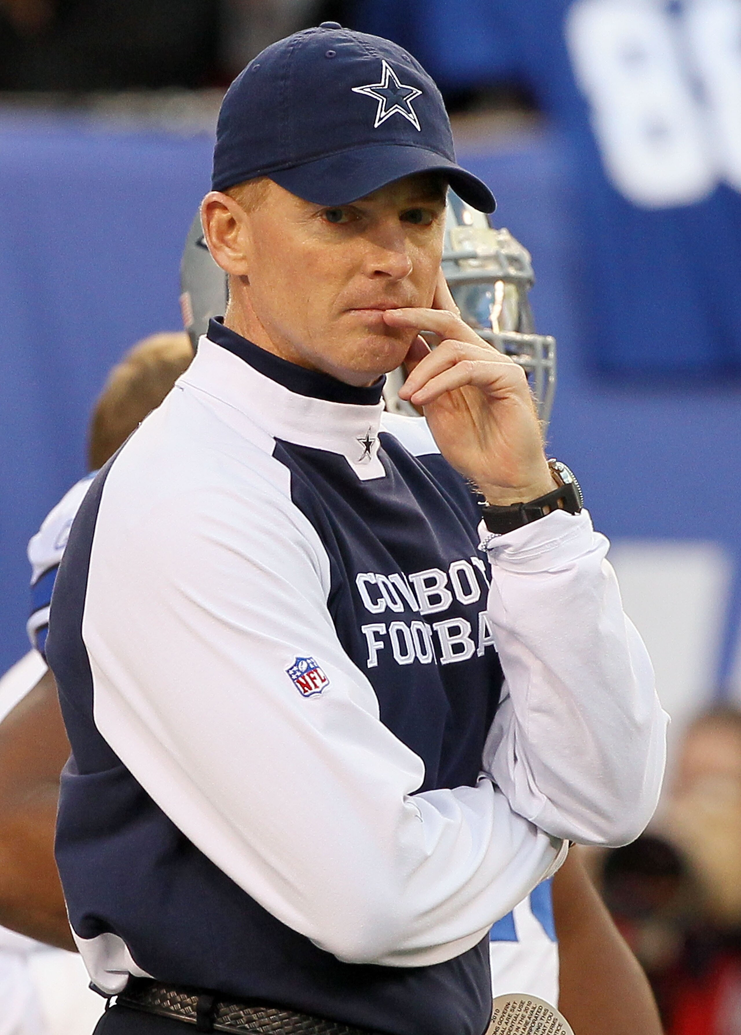 EAST RUTHERFORD, NJ - NOVEMBER 14:  Head coach Jason Garrett of the Dallas Cowboys looks on as his team warms up prior to playing against the New York Giants on November 14, 2010 at the New Meadowlands Stadium in East Rutherford, New Jersey.  (Photo by Ji