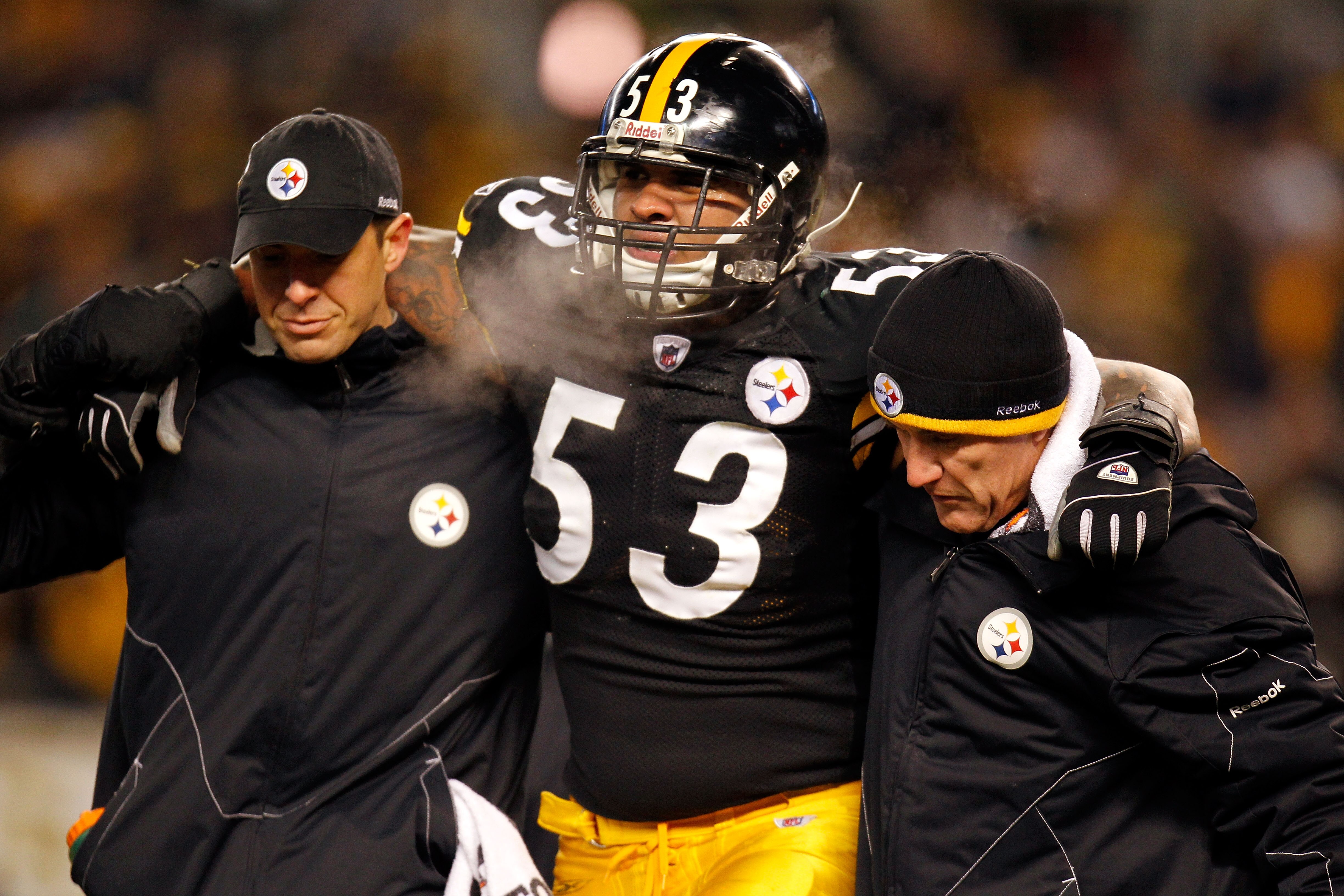 PITTSBURGH, PA - JANUARY 23:  Maurkice Pouncey #53 of the Pittsburgh Steelers is helped off of the field after being injured in the first quarter against the New York Jets during the 2011 AFC Championship game at Heinz Field on January 23, 2011 in Pittsbu