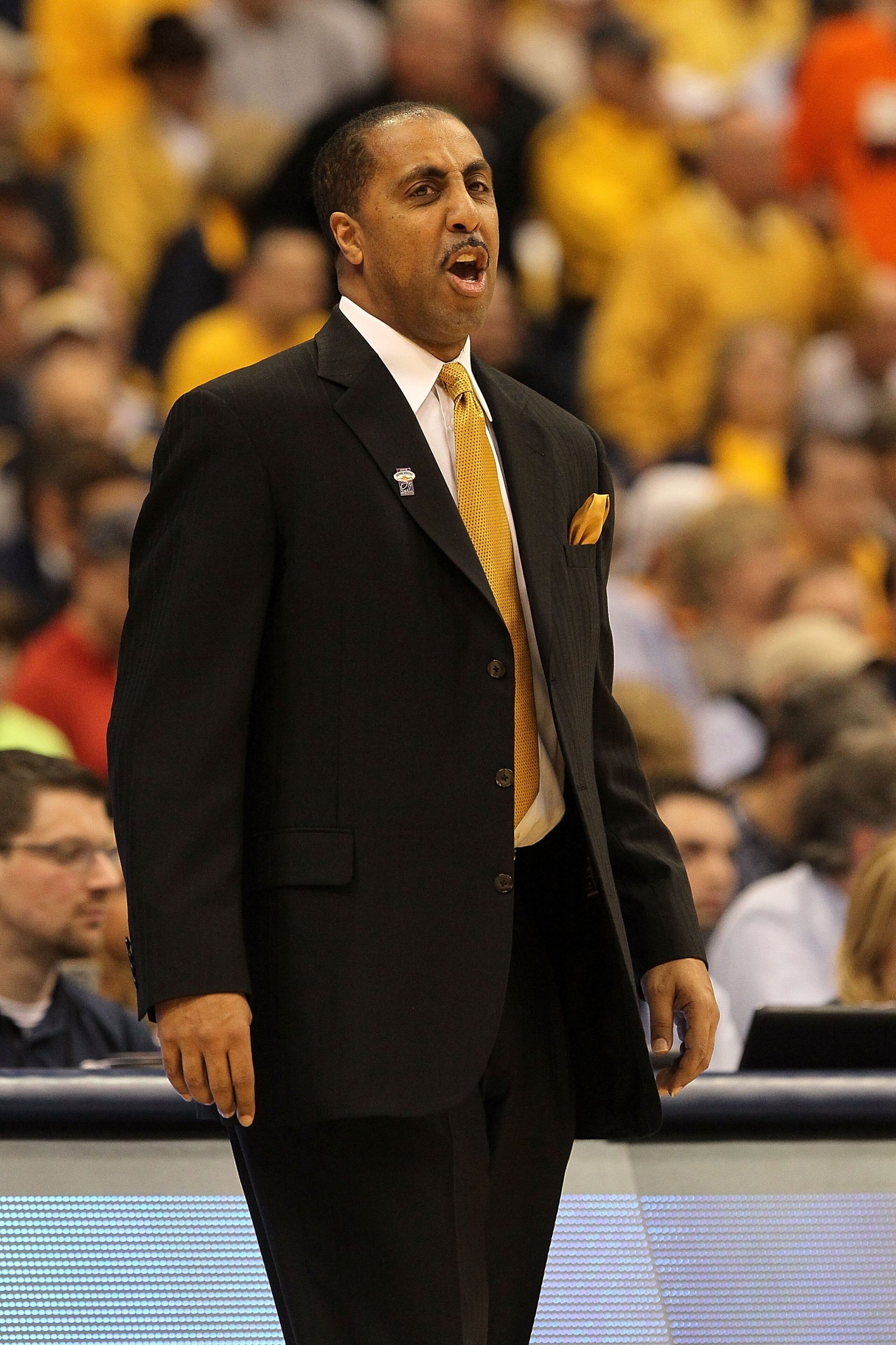 SYRACUSE, NY - MARCH 25:  Head coach Lorenzo Romar of the Washington Huskies reacts as he coaches against the West Virginia Mountaineers during the east regional semifinal of the 2010 NCAA men's basketball tournament at the Carrier Dome on March 25, 2010