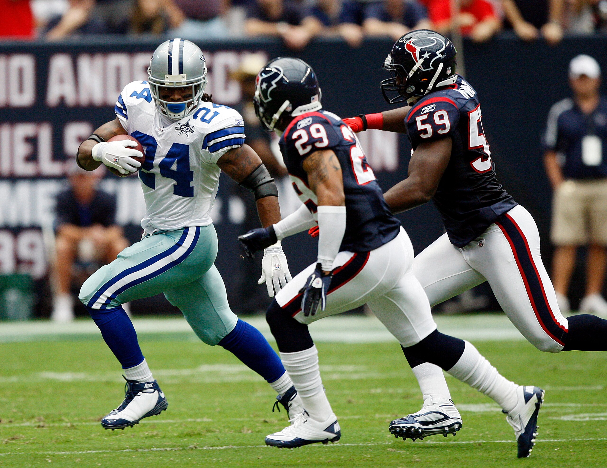 HOUSTON - SEPTEMBER 26:  Running back Marion Barber #24 of the Dallas Cowboys rushes past cornerback Glover Quin #29 and linebacker DeMeco Ryans #59 of the Houston Texans at Reliant Stadium on September 26, 2010 in Houston, Texas.  (Photo by Bob Levey/Get