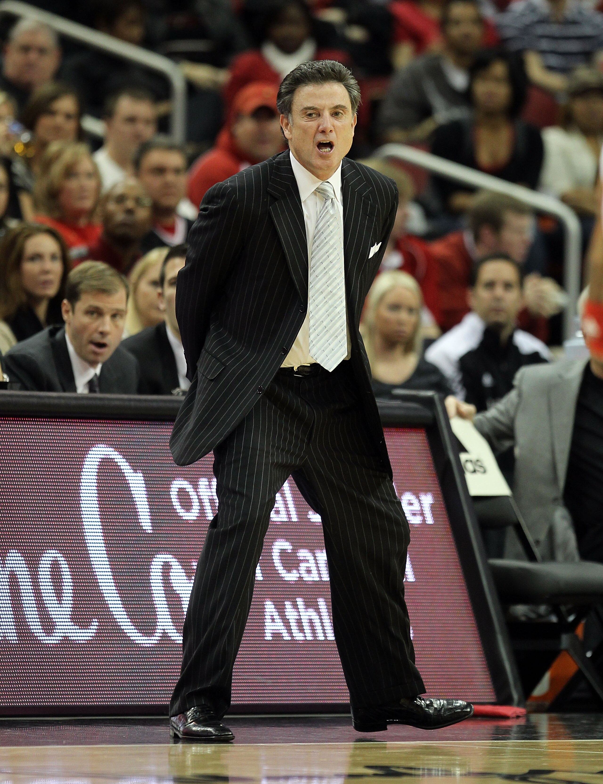 LOUISVILLE, KY - DECEMBER 11:  Rick Pitino the Head Coach of the Louisville Cardinals gives instructions to his team during the game against the UNLV Runnin' Rebels at KFC YUM! Center on December 11, 2010 in Louisville, Kentucky.  (Photo by Andy Lyons/Get