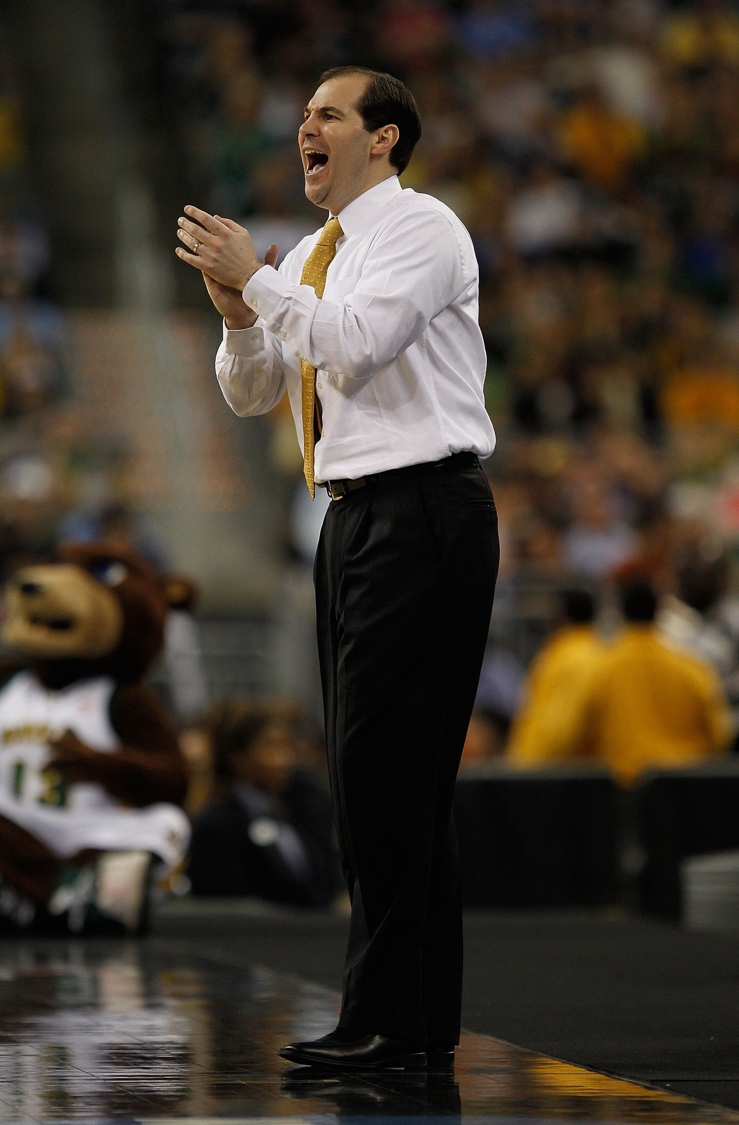 HOUSTON - MARCH 26: Head coach Scott Drew of the Baylor Bears encoruages his team against the St. Mary's Gaels during the south regional semifinal of the 2010 NCAA men's basketball tournament at Reliant Stadium on March 26, 2010 in Houston, Texas. Baylor