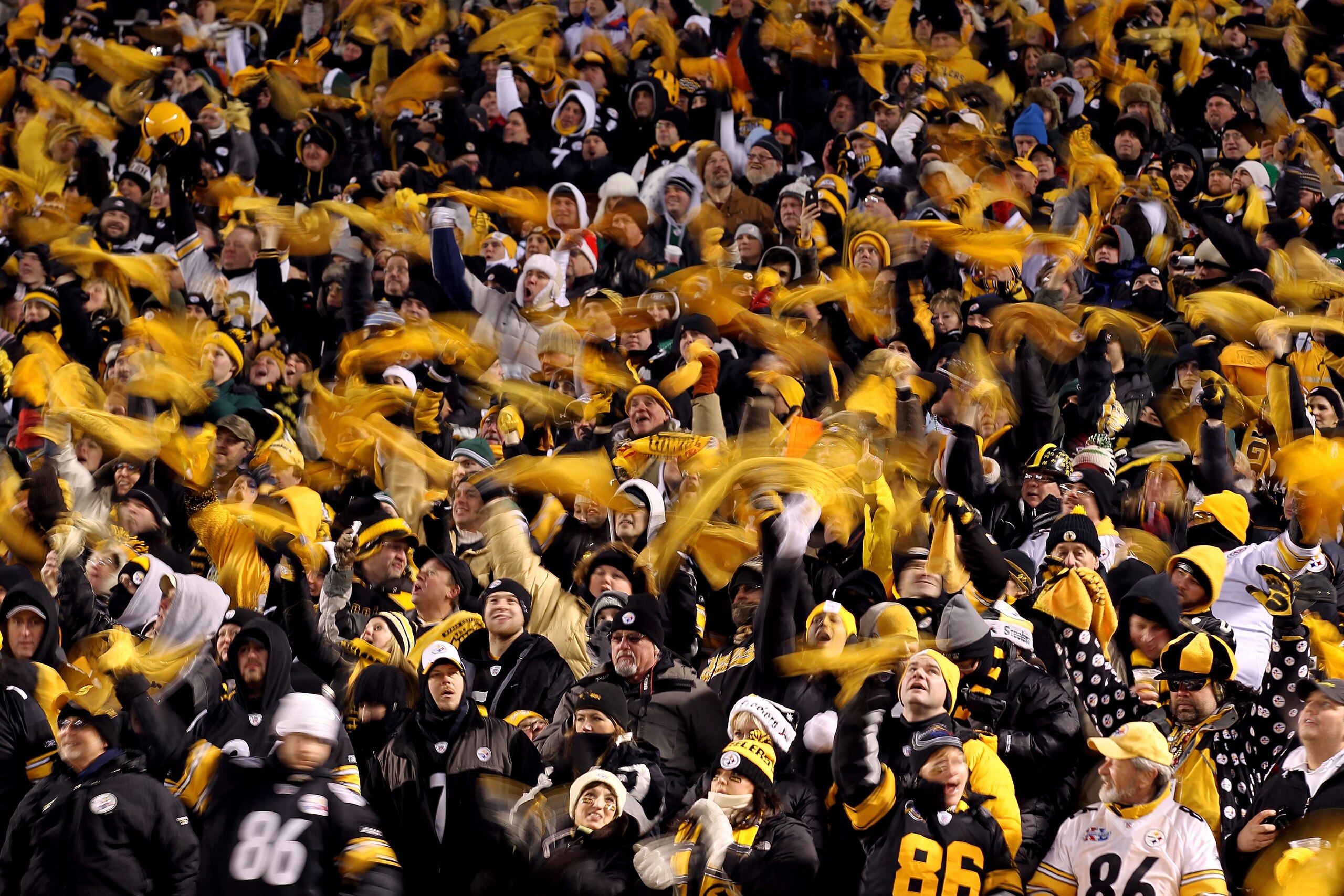 PITTSBURGH, PA - JANUARY 23:  Pittsburgh Steelers fans wave terrible towels during their 2011 AFC Championship game against the New York Jets at Heinz Field on January 23, 2011 in Pittsburgh, Pennsylvania.  (Photo by Al Bello/Getty Images)