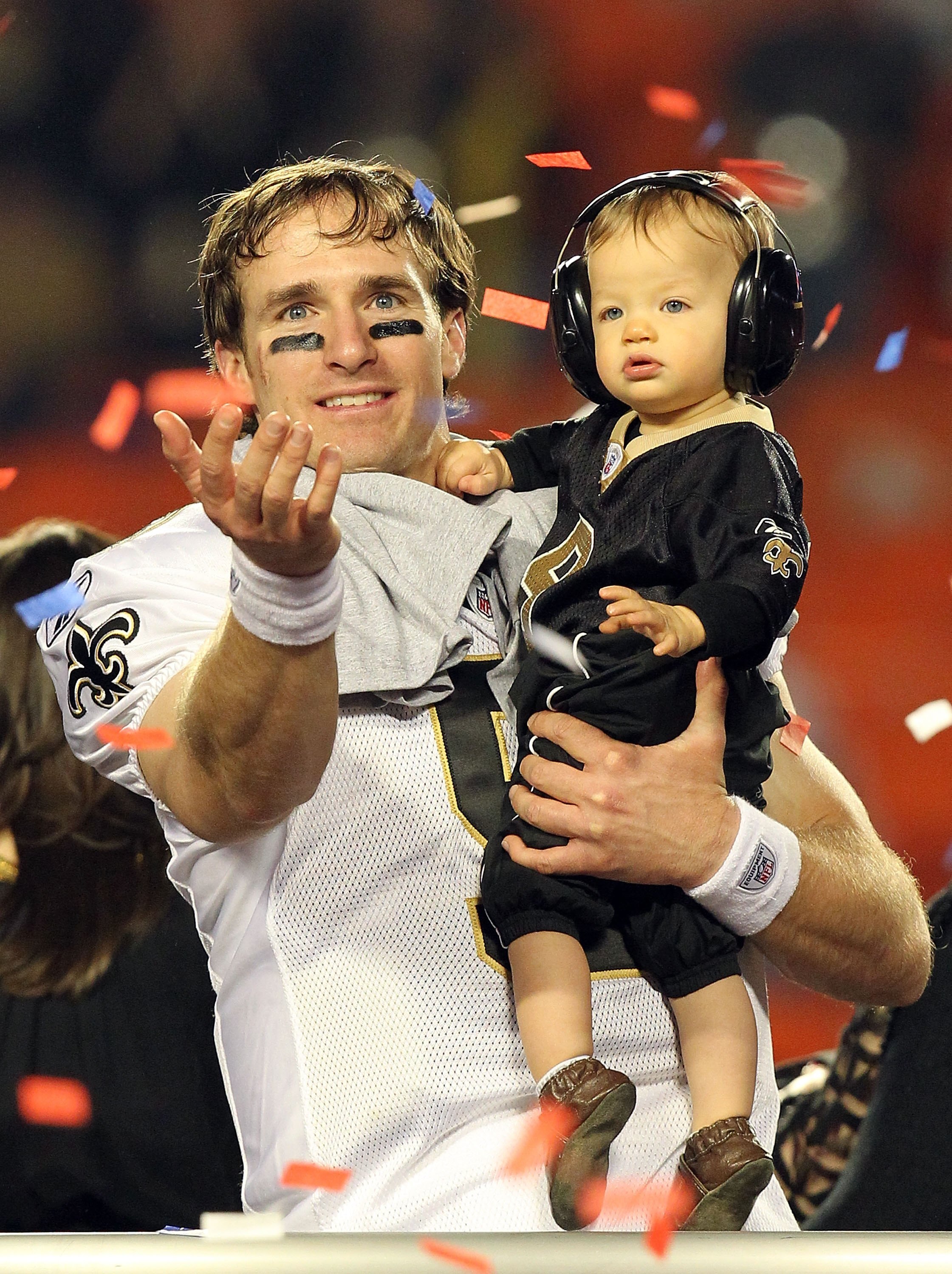 MIAMI GARDENS, FL - FEBRUARY 07:  Drew Brees #9 of the New Orleans Saints celebrates with his son Baylen Brees after defeating the Indianapolis Colts during Super Bowl XLIV on February 7, 2010 at Sun Life Stadium in Miami Gardens, Florida.  (Photo by Rona