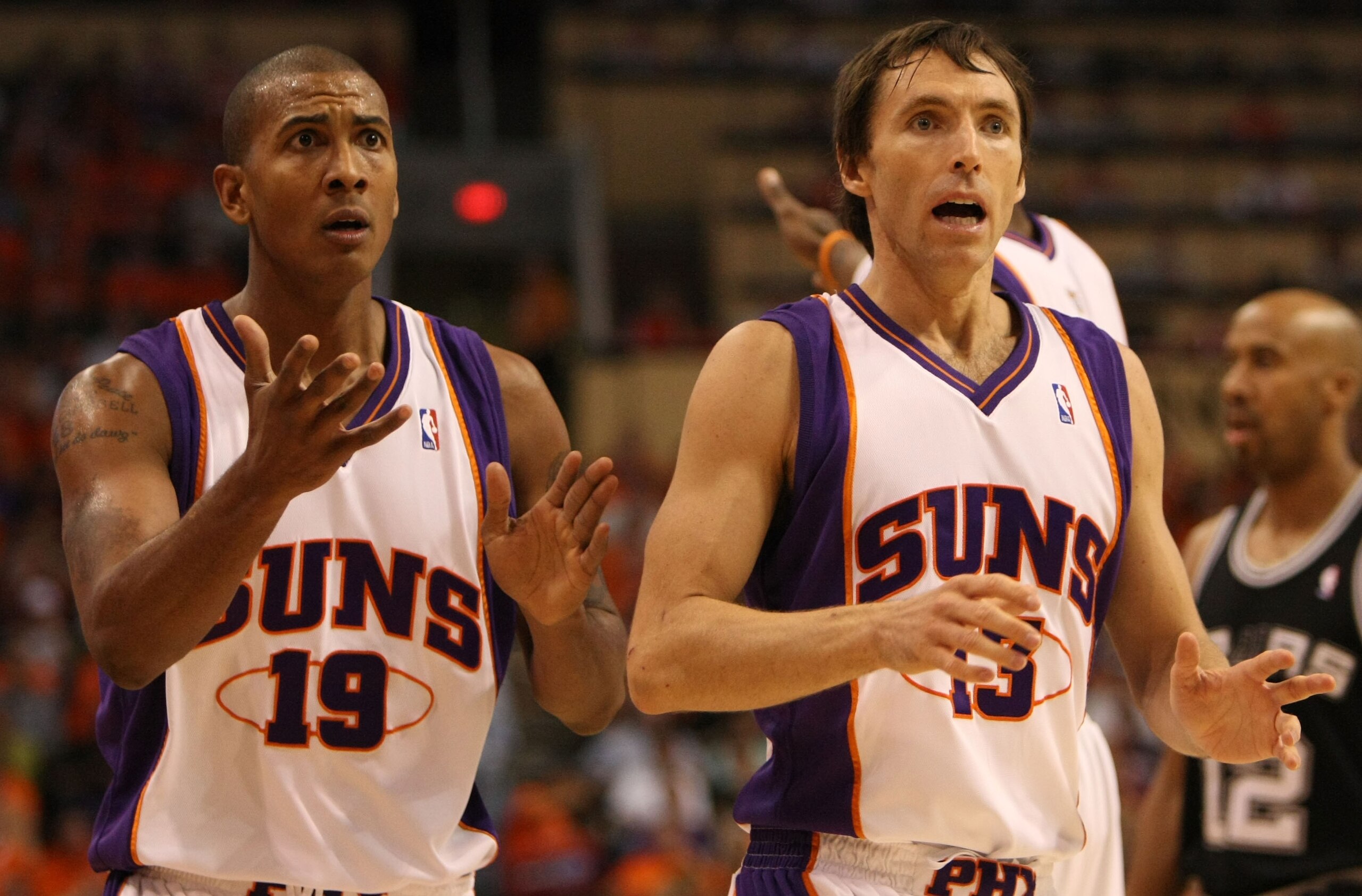 PHOENIX - APRIL 25:  Steve Nash #13 and Raja Bell #19 of the Phoenix Suns react to a call against the San Antonio Spurs during Game Three of the Western Conference Quarterfinals during the 2008 at NBA Playoffs at the at U.S. Airways Center on April 25, 20