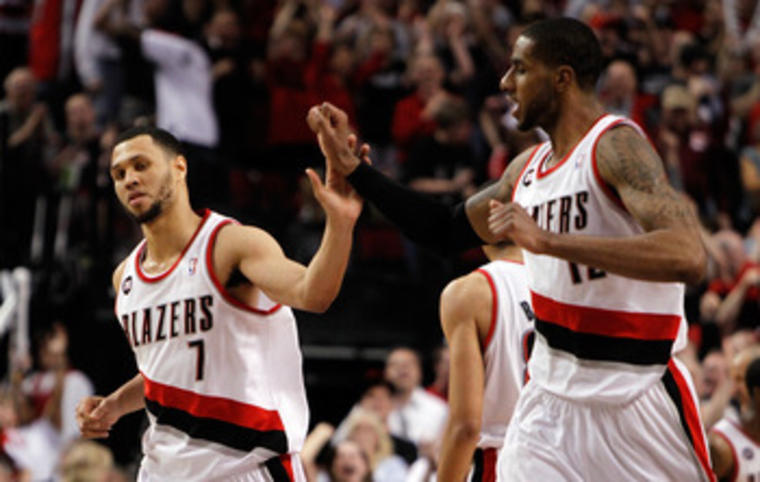 PORTLAND, OR - APRIL 23:  Brandon Roy #7 high fives LaMarcus Aldridge #12 of the Portland Trail Blazers against the Dallas Mavericks in Game Four of the Western Conference Quarterfinals in the 2011 NBA Playoffs on April 23, 2011 at the Rose Garden in Port
