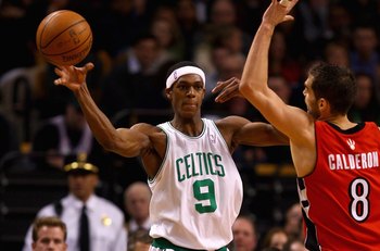 BOSTON - JANUARY 23:  Rajon Rondo #9 of the Boston Celtics passes the ball over Jose Calderon #8 of the Toronto Raptors during the game on January 23, 2008 at the TD Banknorth Garden in Boston, Massachusetts.  The Raptors won 114-112.  NOTE TO USER: User