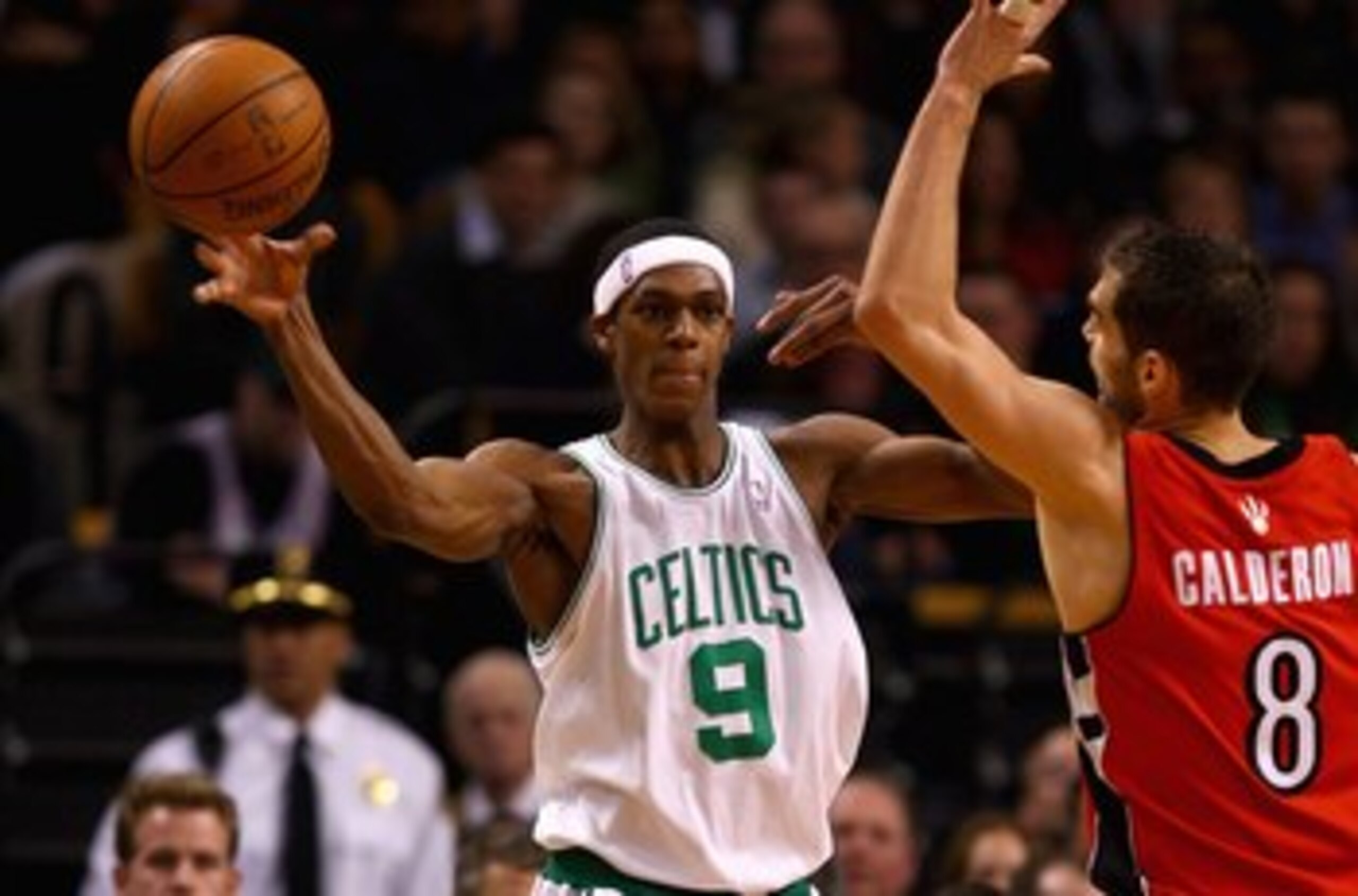 BOSTON - JANUARY 23:  Rajon Rondo #9 of the Boston Celtics passes the ball over Jose Calderon #8 of the Toronto Raptors during the game on January 23, 2008 at the TD Banknorth Garden in Boston, Massachusetts.  The Raptors won 114-112.  NOTE TO USER: User