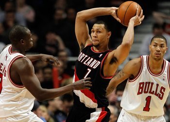 CHICAGO - FEBRUARY 26: Brandon Roy #7 of the Portland Trail Blazers looks to pass under pressure from Loul Deng #9 and Derrick Rose #1 of the Chicago Bulls at the United Center on February 26, 2010 in Chicago, Illinois. The Bulls defeated the Trail Blazer
