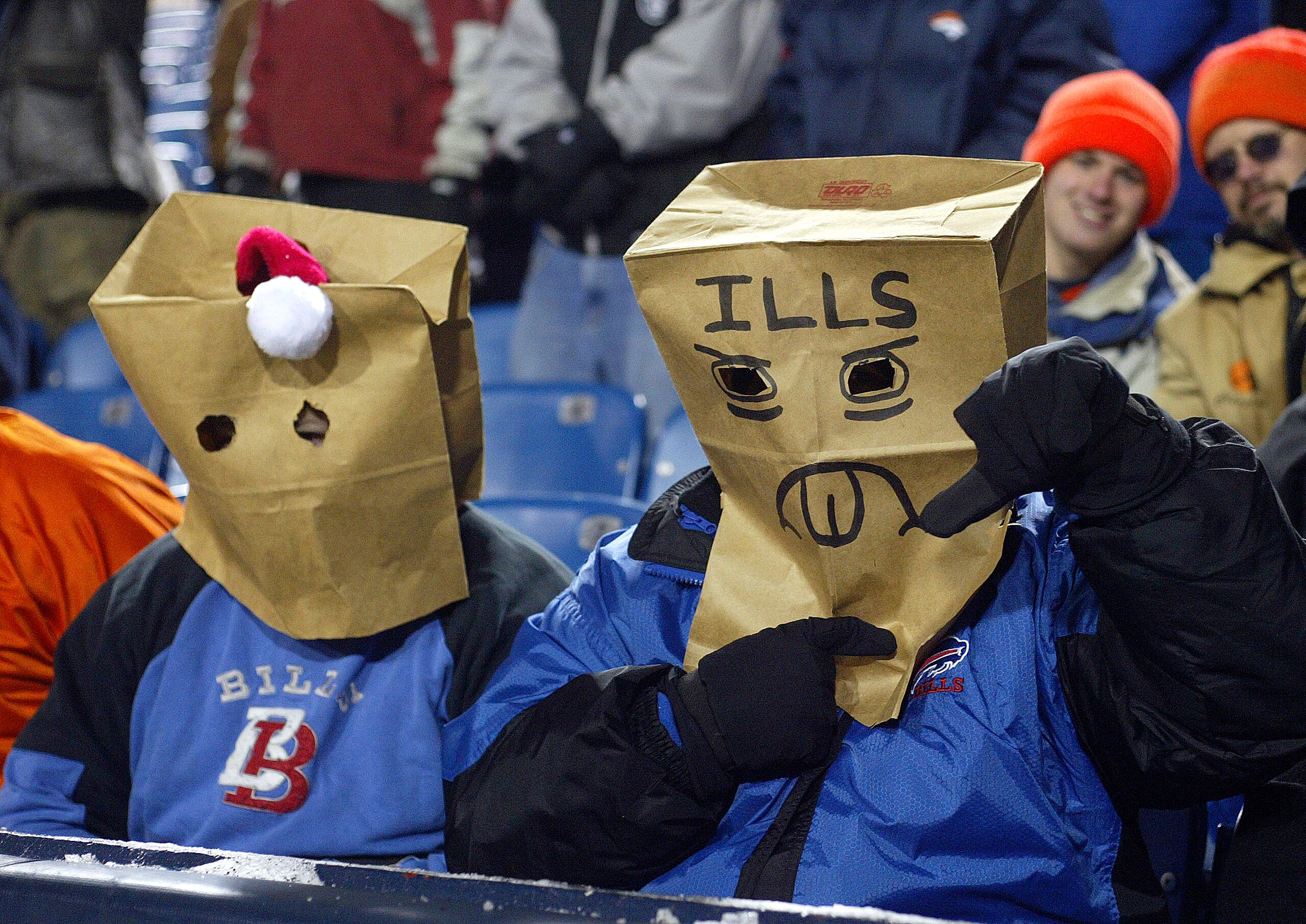 ORCHARD PARK, NY - DECEMBER 17:  Fans of the Buffalo Bills sit with paper bags over their heads during a loss to the Denver Broncos on December 17, 2005 at Ralph Wilson Stadium in Orchard Park, New York. The Broncos defeated the Bills 28-17.  (Photo by Ri