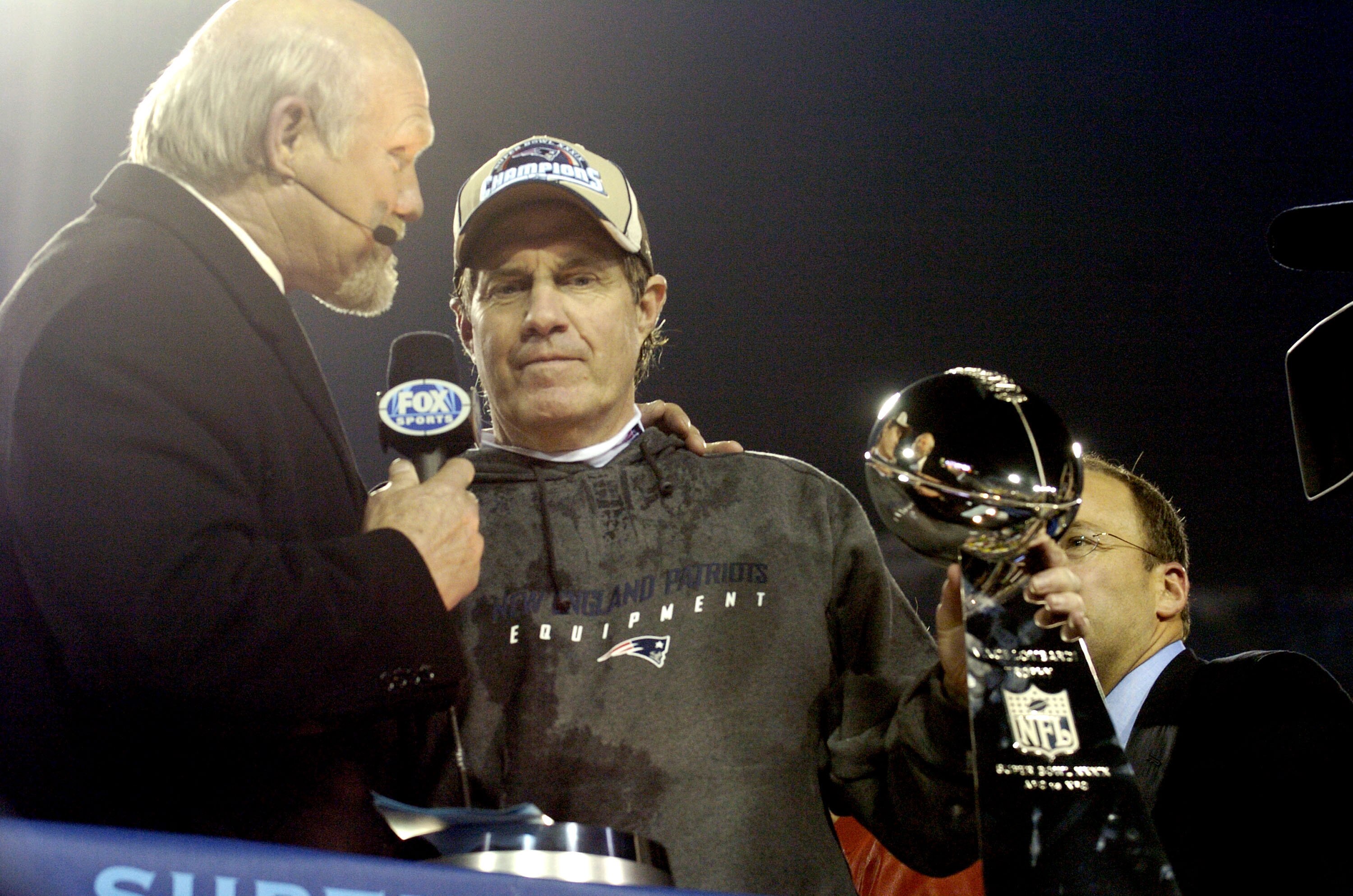 New England Patriots Head Coach Bill Belichick holds The Vince Lombardi Trophy after the Patriots won Super Bowl XXXIX at Alltel Stadium in Jacksonville, Florida on February 6, 2005.  (Photo by Al Messerschmidt/Getty Images)