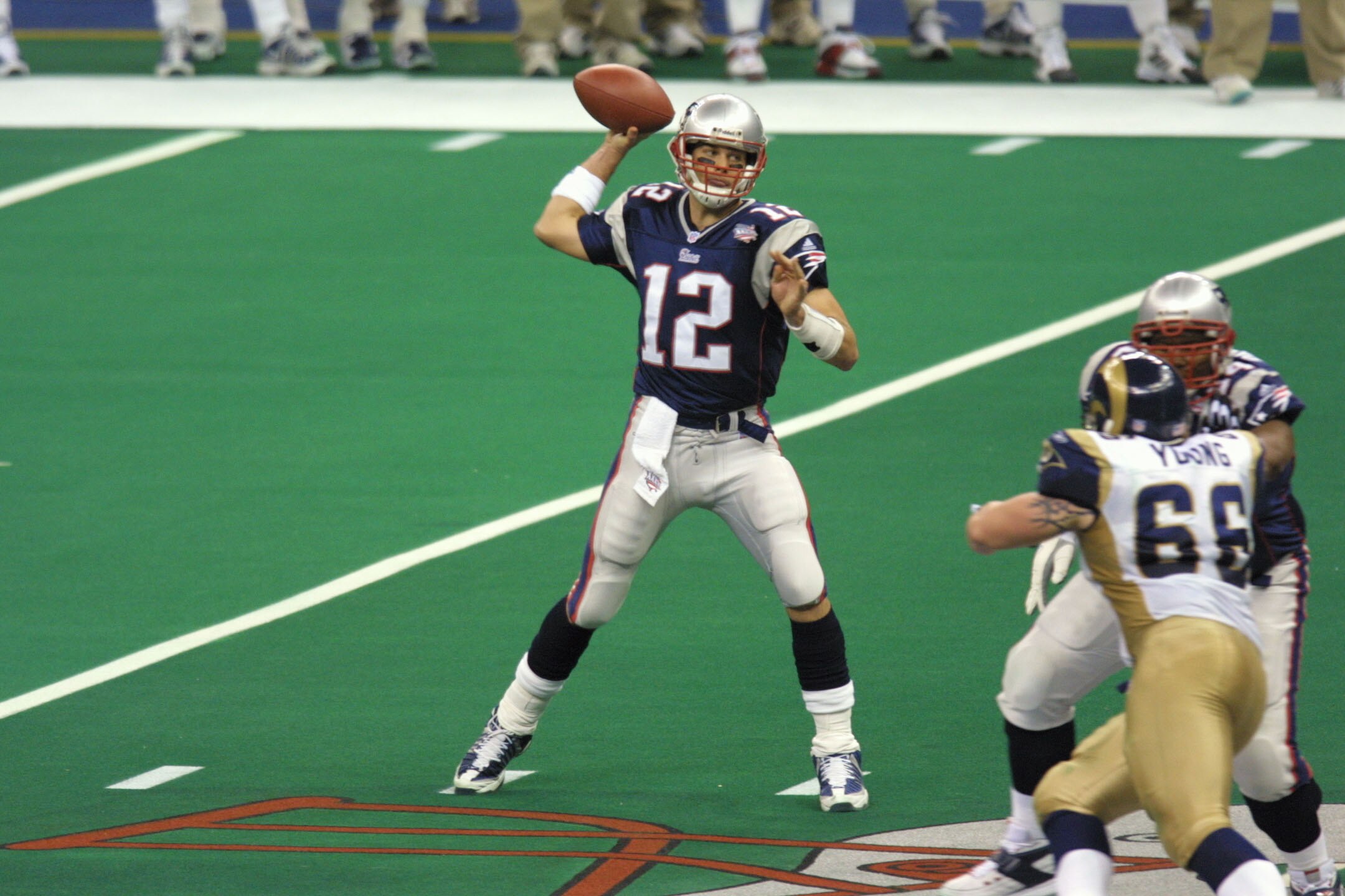 03 Feb 2002:  Quarterback Tom Brady #12 of the New England Patriots winds up to throw a pass against the St.Louis Rams  during Superbowl XXXVI at the Superdome in New Orleans, Louisiana.  The Patriots defeated the Rams 20-17. DIGITAL IMAGE. Mandatory Cred