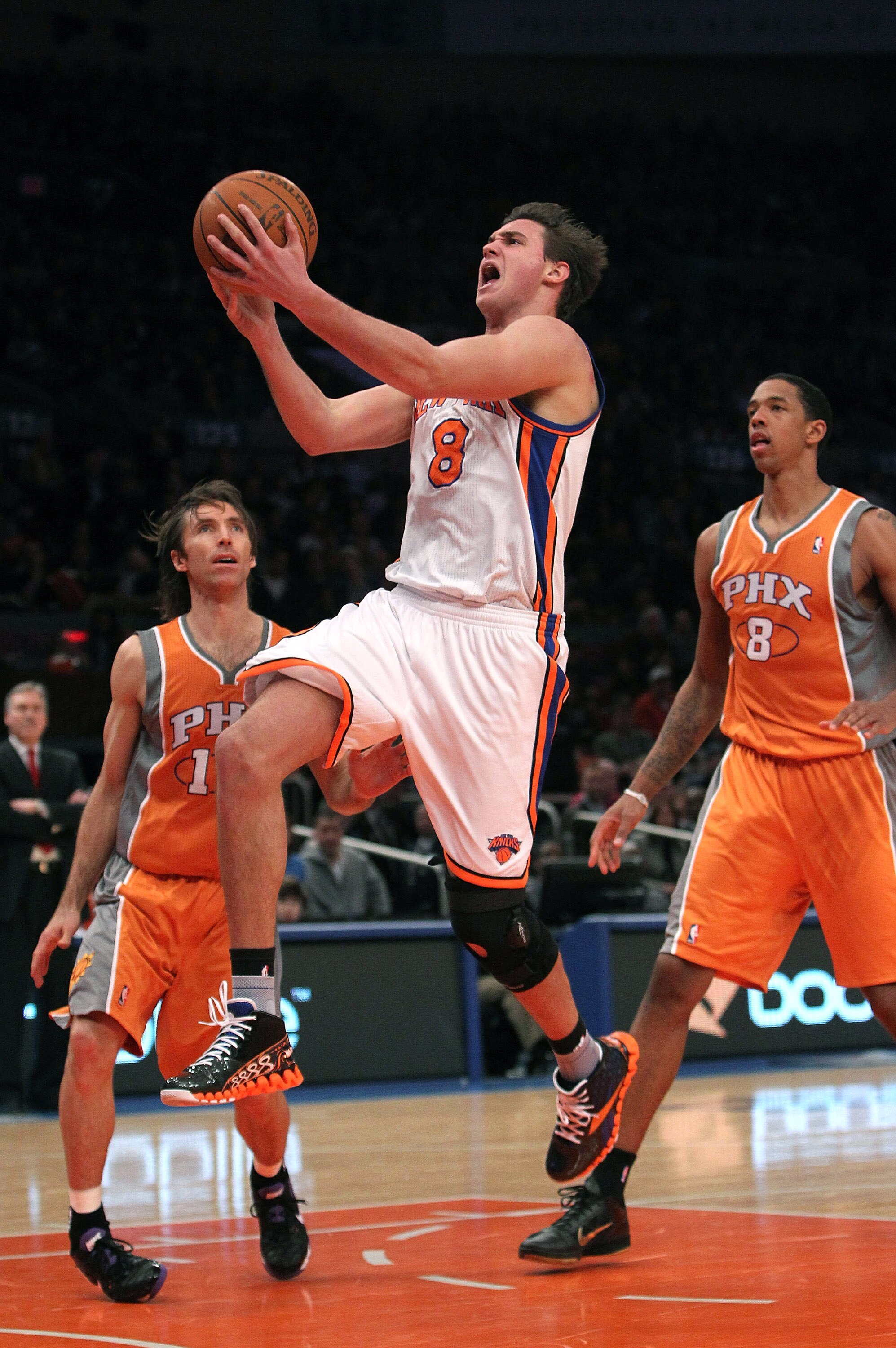 NEW YORK, NY - JANUARY 17: Danilo Gallinari #8 of the New York Knicks lays the ball up against the Phoenix Suns at Madison Square Garden on January 17, 2011 in New York City. NOTE TO USER: User expressly acknowledges and agrees that, by downloading and or