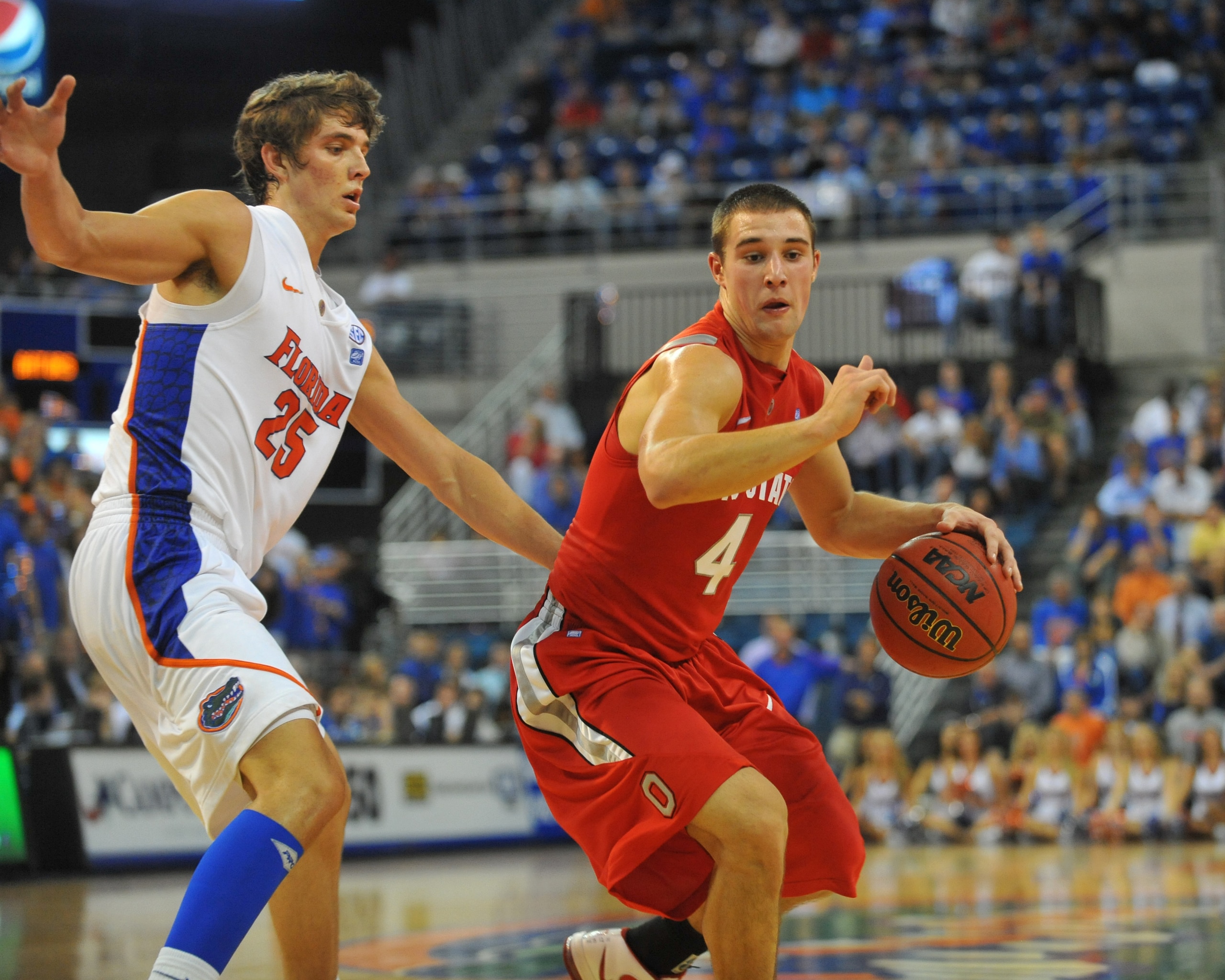 GAINESVILLE, FL - NOVEMBER 16: Guard Aaron Craft #4 of the Ohio State Buckeyes drives up court against the Florida Gators November 16, 2010 at the Stephen C. O'Connell Center in Gainesville, Florida.  (Photo by Al Messerschmidt/Getty Images)