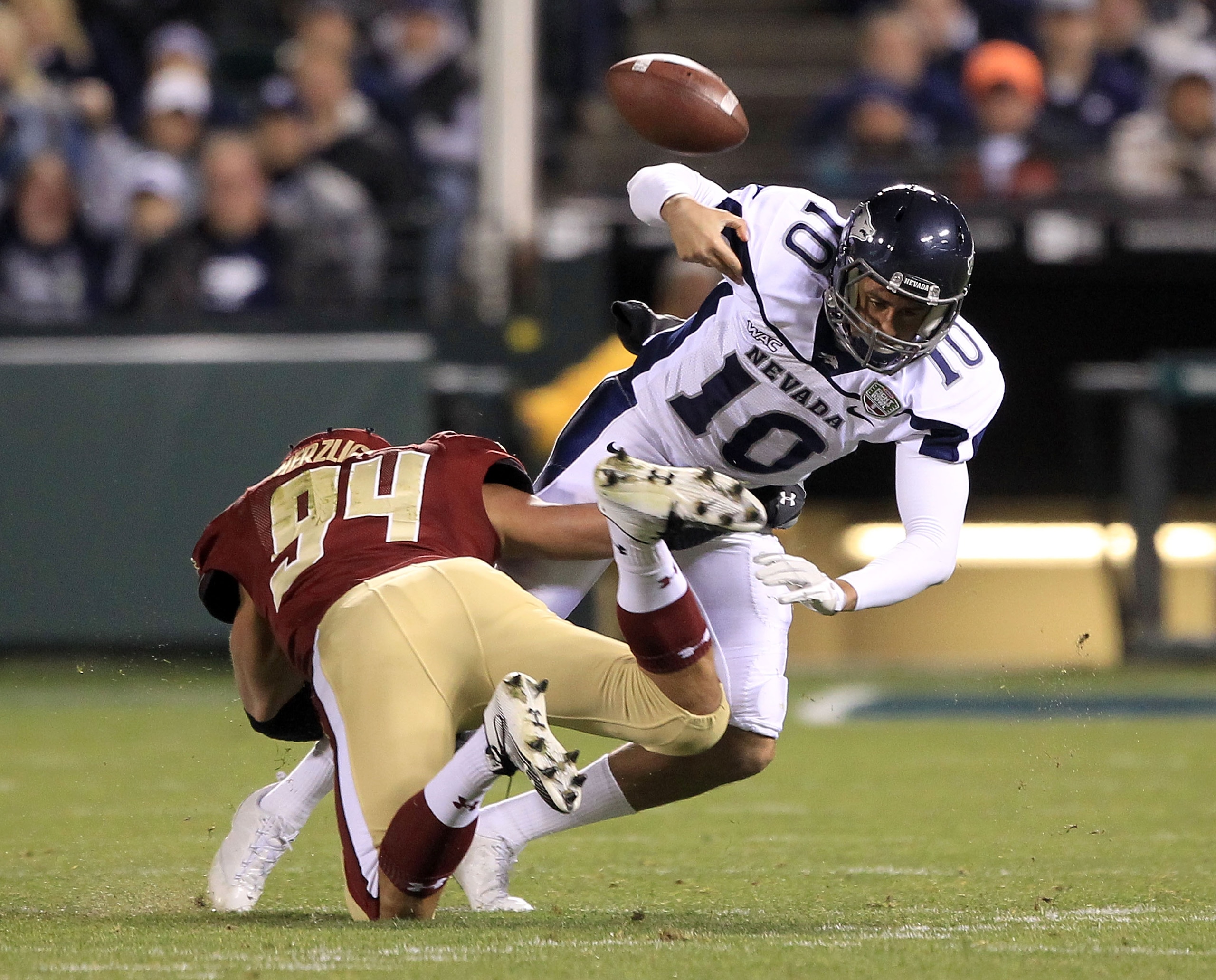 SAN FRANCISCO, CA - JANUARY 09: Colin Kaepernick #10 of the Nevada Wolf Pack fumbles the ball after being hit by Mark Herzlich #94 of the Boston College during the Kraft Fight Hunger Bowl at AT&T Park on January 9, 2011 in San Francisco, California. (Ph SAN FRANCISCO, CA - JANUARY 09: Colin Kaepernick #10 of the Nevada Wolf Pack fumbles the ball after being hit by Mark Herzlich #94 of the Boston College during the Kraft Fight Hunger Bowl at AT&T Park on January 9, 2011 in San Francisco, California. (Ph