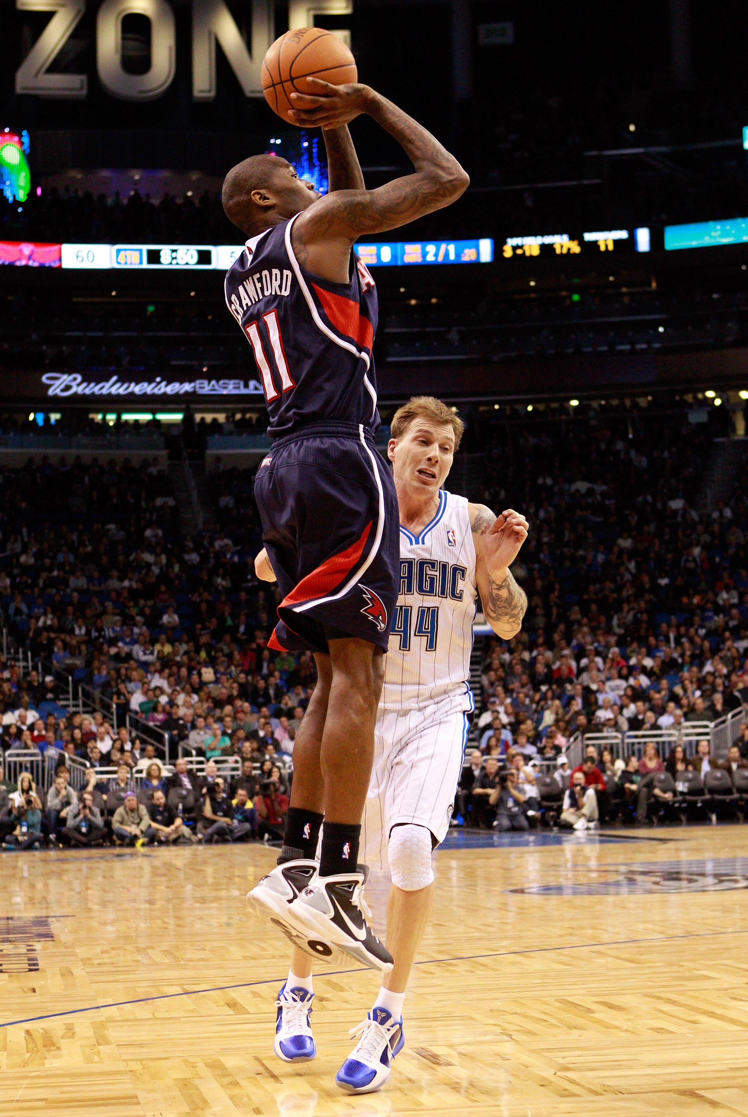 ORLANDO, FL - DECEMBER 06: Jamal Crawford #11 of the Atlanta Hawks shoots over Jason Williams #44 of the Orlando Magic during the game at Amway Arena on December 6, 2010 in Orlando, Florida. NOTE TO USER: User expressly acknowledges and agrees that, by d ORLANDO, FL - DECEMBER 06: Jamal Crawford #11 of the Atlanta Hawks shoots over Jason Williams #44 of the Orlando Magic during the game at Amway Arena on December 6, 2010 in Orlando, Florida. NOTE TO USER: User expressly acknowledges and agrees that, by d