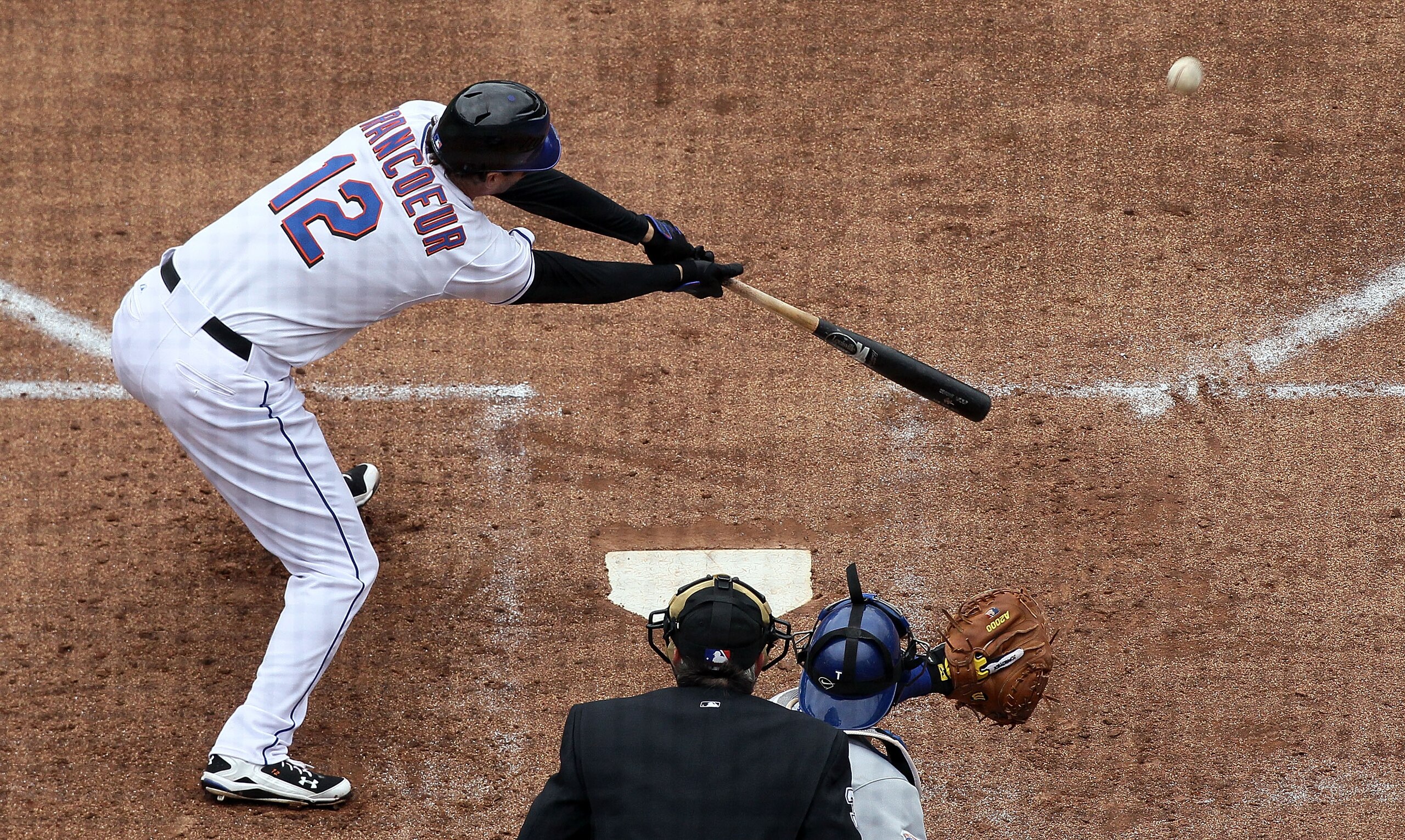 NEW YORK - APRIL 28:  Jeff Francoeur #12 of the New York Mets connects for a third inning RBI double against the Los Angeles Dodgers on April 28, 2010 at Citi Field in the Flushing neighborhood of the Queens borough of New York City.  (Photo by Jim McIsaa