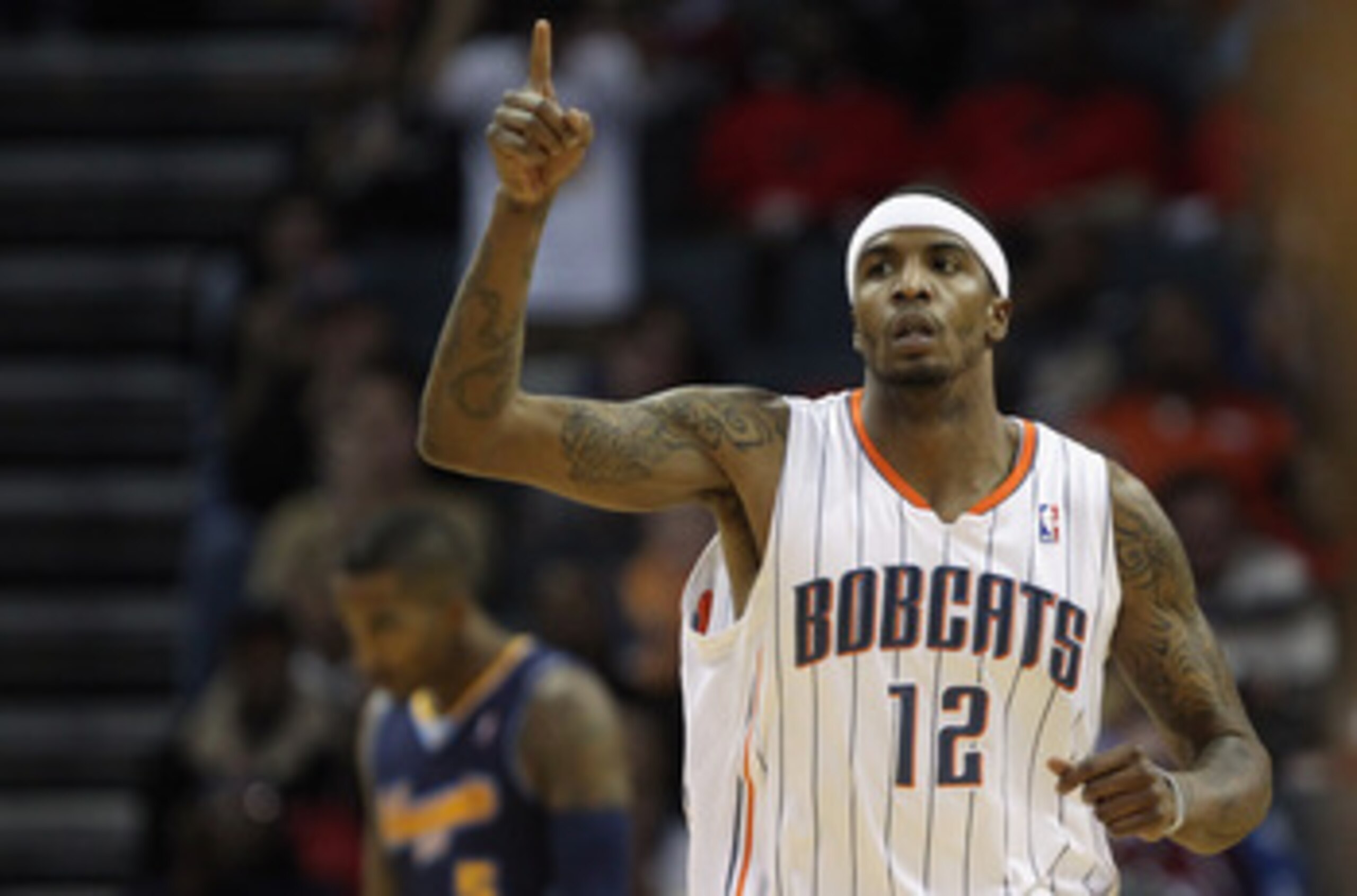 CHARLOTTE, NC - DECEMBER 07:  Tyrus Thomas #12 of the Charlotte Bobcats reacts to scoring against the Denver Nuggets during their game at Time Warner Cable Arena on December 7, 2010 in Charlotte, North Carolina.  NOTE TO USER: User expressly acknowledges