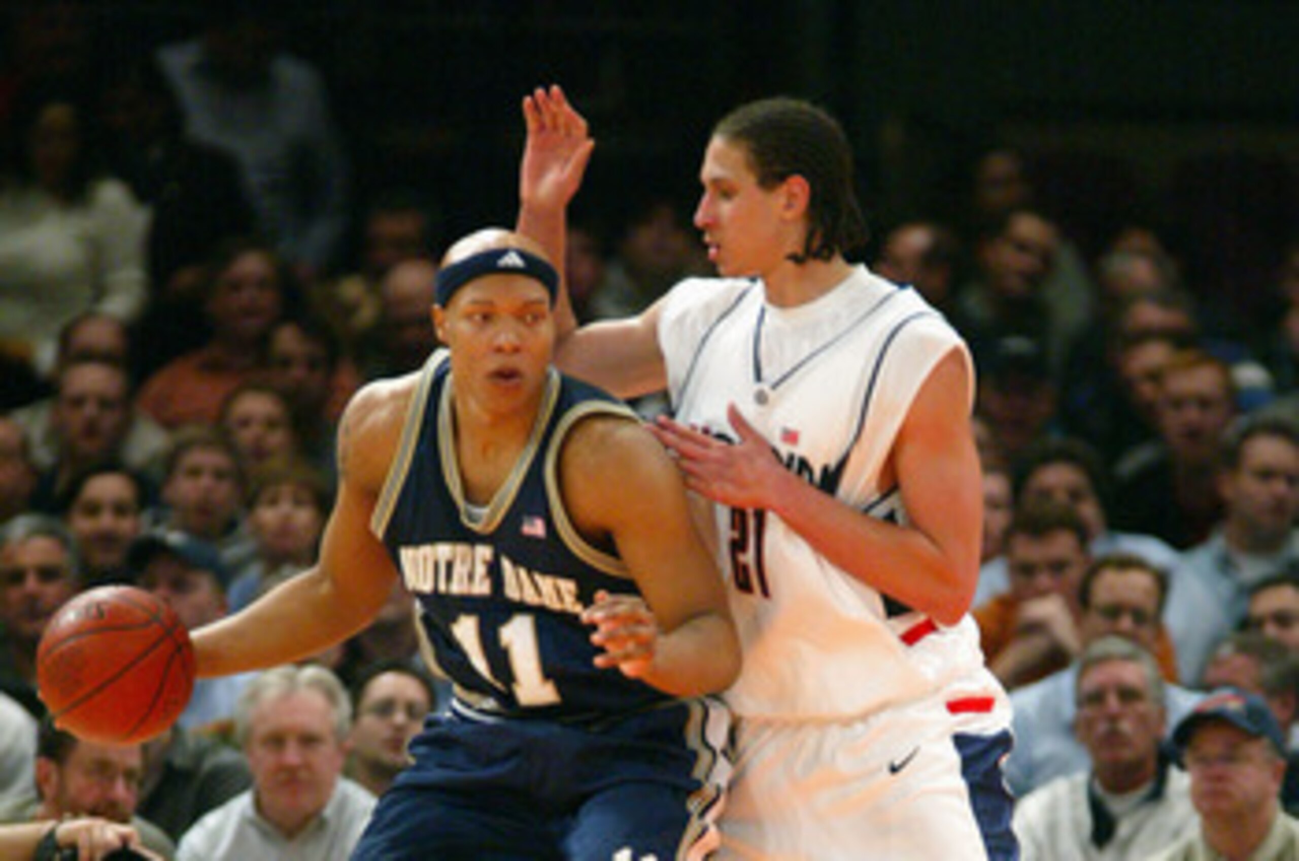 NEW YORK - MARCH 11:  Hilton Armstrong #11 of the Notre Dame Fighting Irish posts up Josh Boone #21 of the Connecticut Huskies during their Quarterfinal game of the Big East Championship Tournament on March 11, 2004 at Madison Square Garden in New York Ci