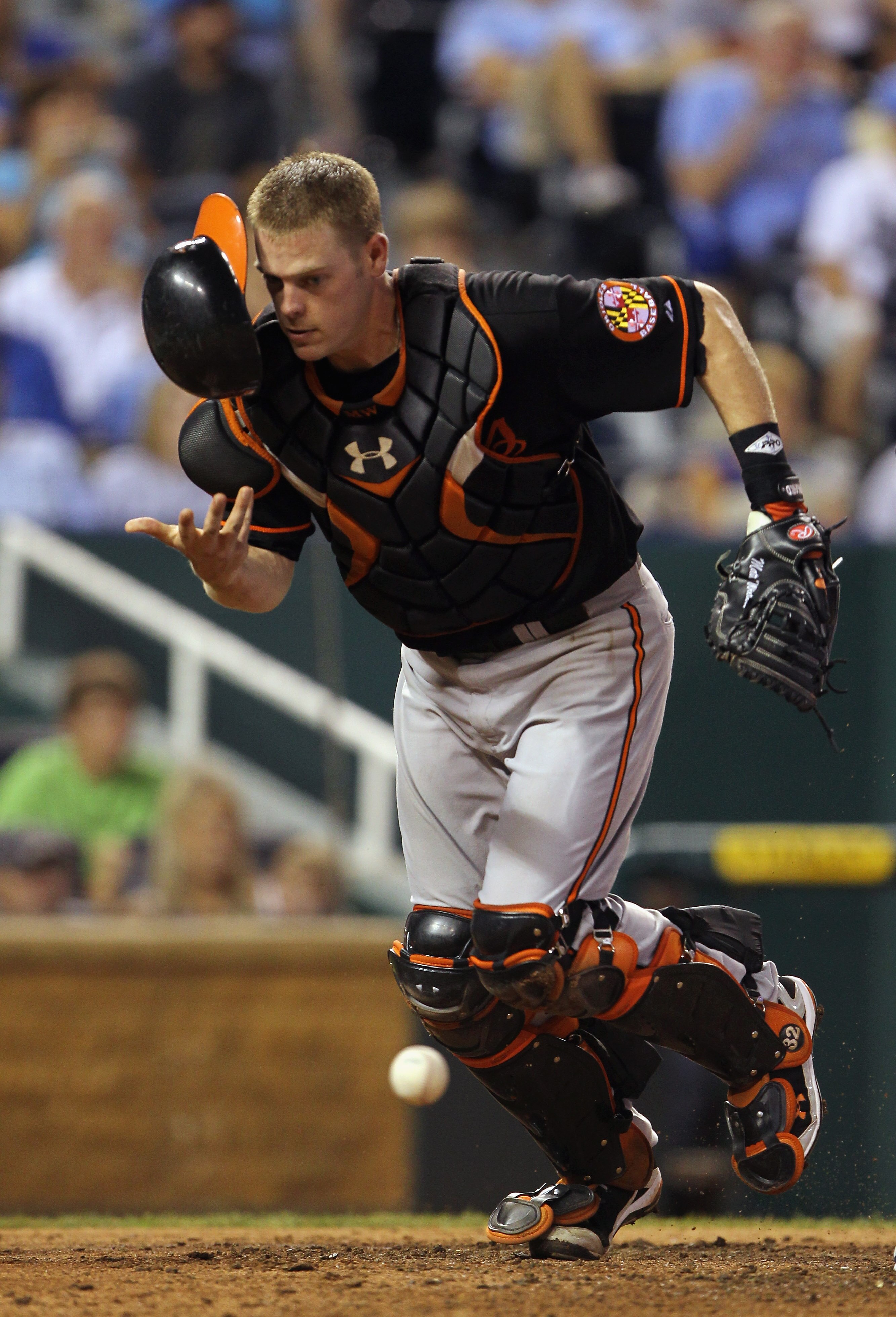 KANSAS CITY, MO - JULY 30:  Catcher Matt Wieters #32 of the Baltimore Orioles chases a wild pitch by Jake Arrieta #57 during the 5th inning of the game against the Kansas City Royals on July 30, 2010 at Kauffman Stadium in Kansas City, Missouri.  (Photo b