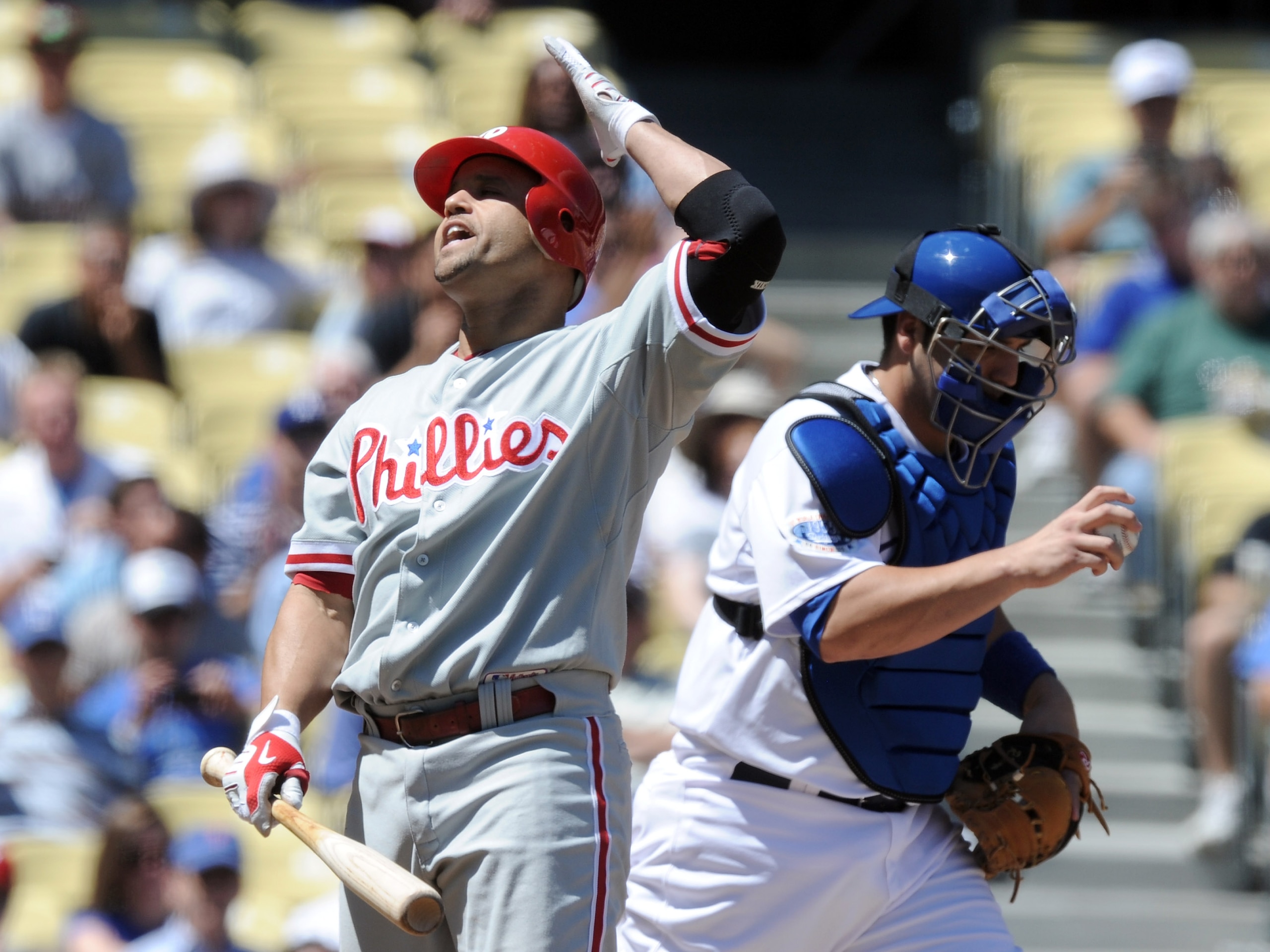 LOS ANGELES, CA - SEPTEMBER 01:  Placido Polanco #27 of the Philadelphia Phillies reacts to a called strikeout in front of Rod Barajas #28 of the Los Angeles Dodgers during the first inning at Dodger Stadium on September 1, 2010 in Los Angeles, California