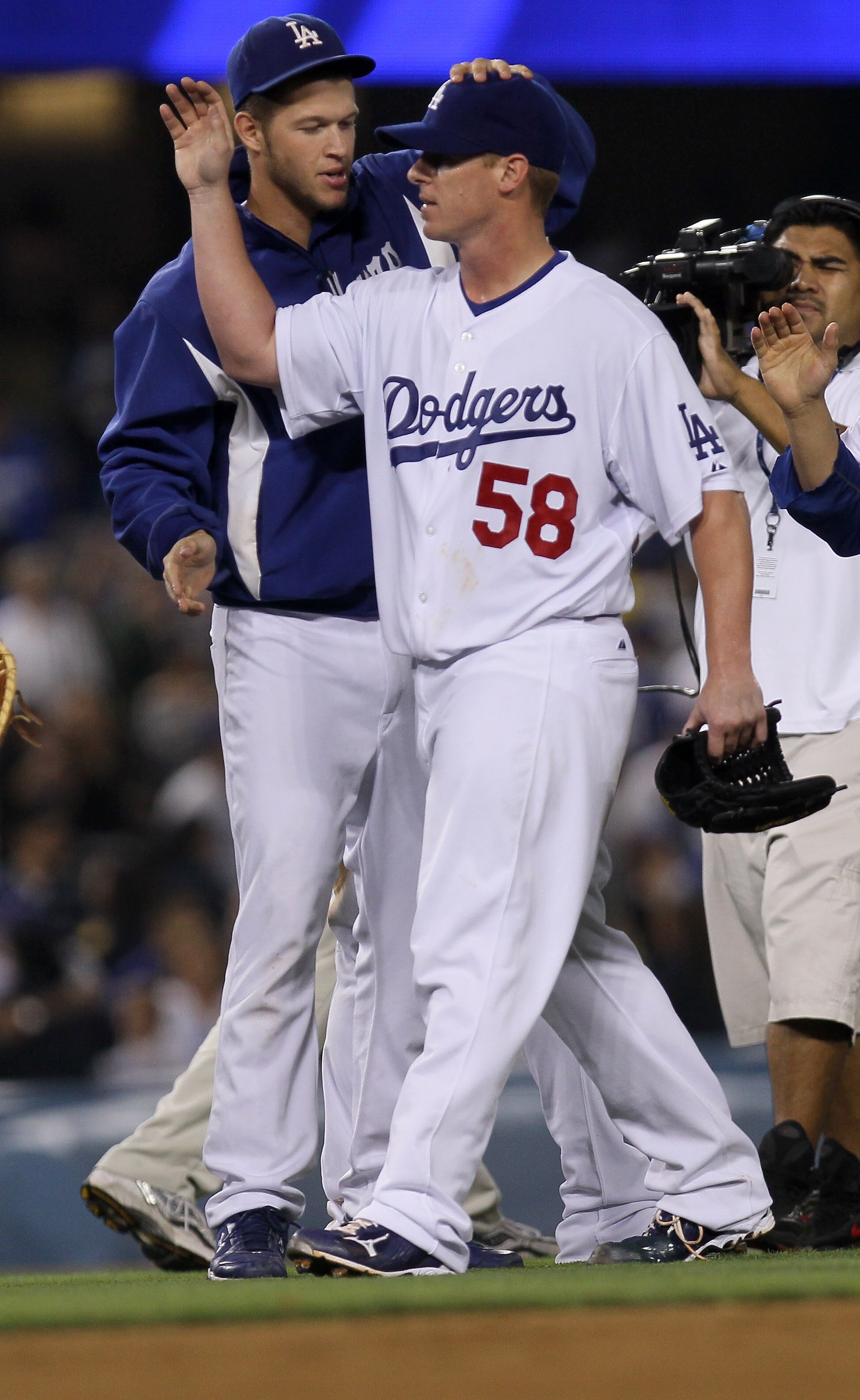 LOS ANGELES, CA - JULY 21:  Pitcher Chad Billingsley #58 of the Los Angeles Dodgers is congratulated by fellow pitcher Clayton Kershaw #22 after his complete game shutout against the San Francisco Giants on July 21, 2010 at Dodger Stadium in Los Angeles,